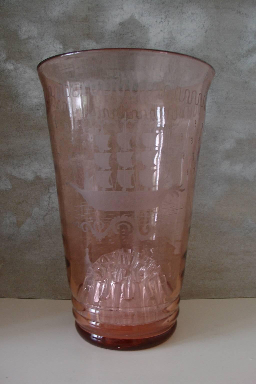 An exceptionally tall light pink vase with wonderful acid etched or engraved detail. Possibly English, early 20th century. Has inset a moulded glass flower distributor.