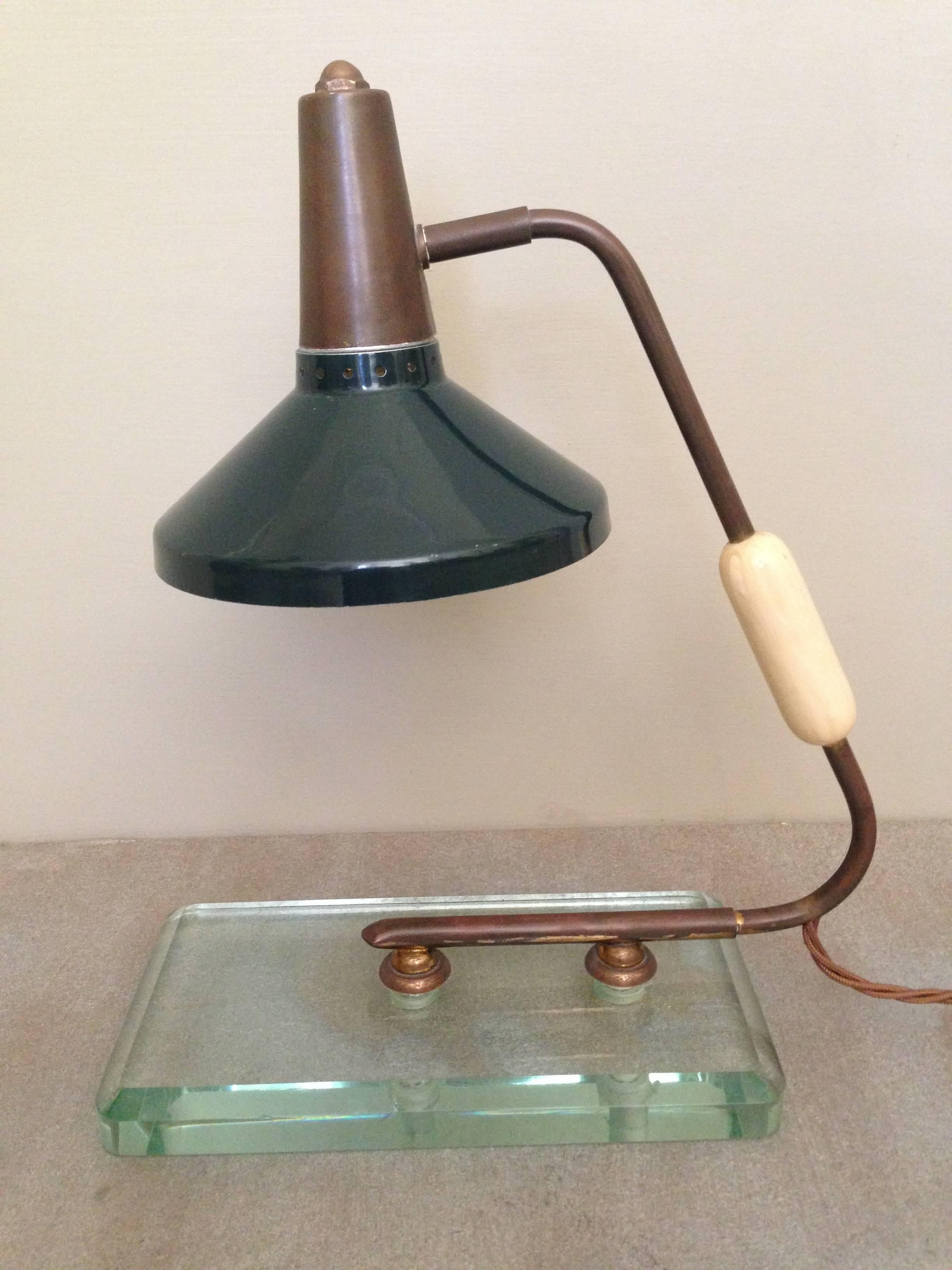 A good original early Italian small desk lamp. Metal work is nicely patinated, the paint original as is the thick glass. Bone handle decoration. The shade pivotes from left to right. Rewired with silk flex to UK standards.