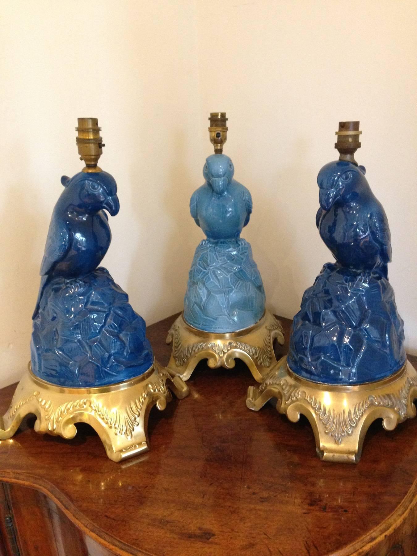Edwardian Set of Three Fabulous Glazed Blue Porcelain Parrot Lamps on Gilt Bronze Mounts