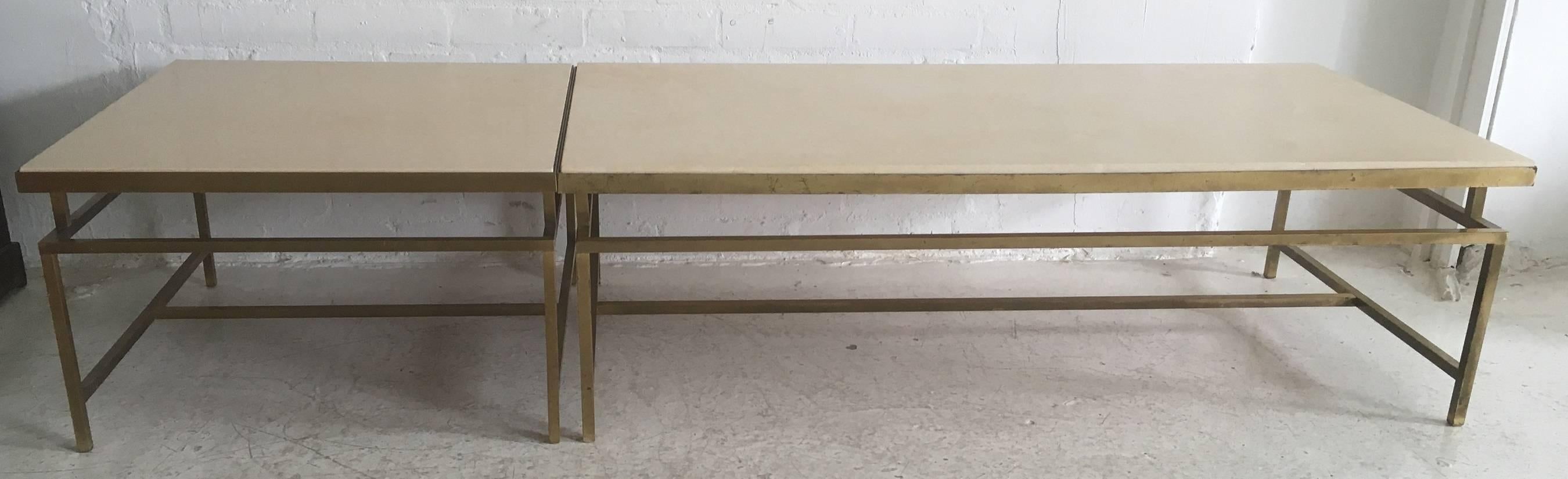 A very elegant set of a matching side table and coffee table. Solid brass patinated base with a replaced sandstone colored stone, French, circa 1970s.