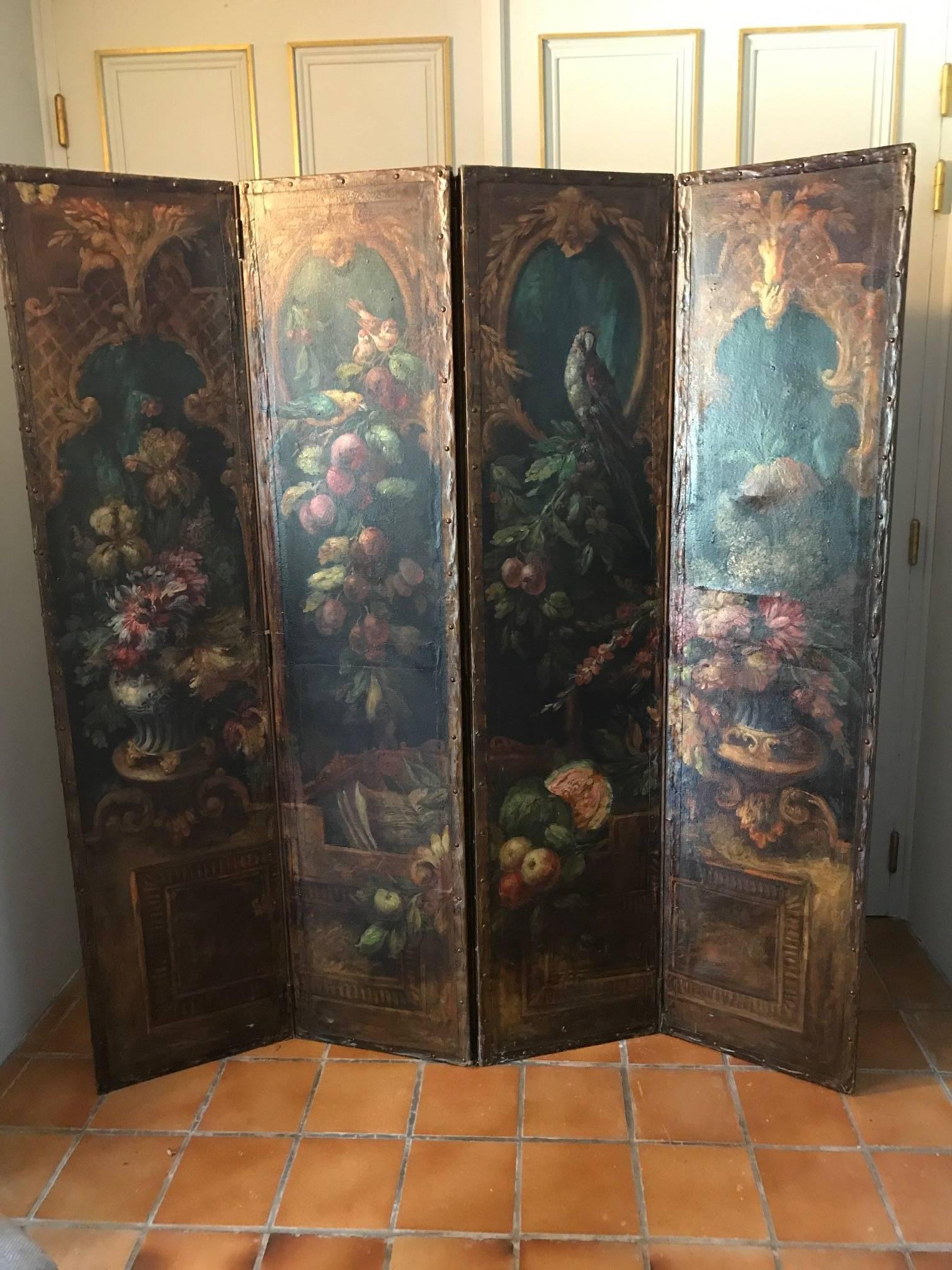 A beautiful four panel folding screen with exquisite foliage and bird decoration. The four panels have simple leather lining. The screen is French and dates from the late 18th early 19th century. As with most screens it has some repairs to the