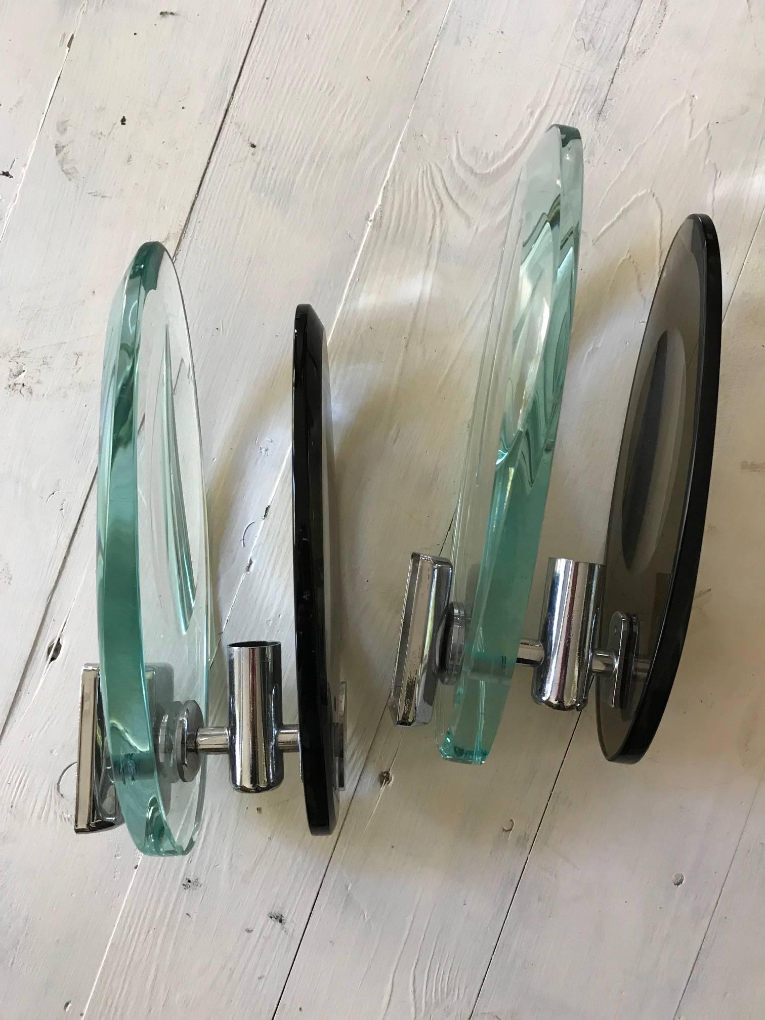 A pair of chrome and glass two tone Italian wall lights produced by Cristel Arte. Italian, 1960s.
