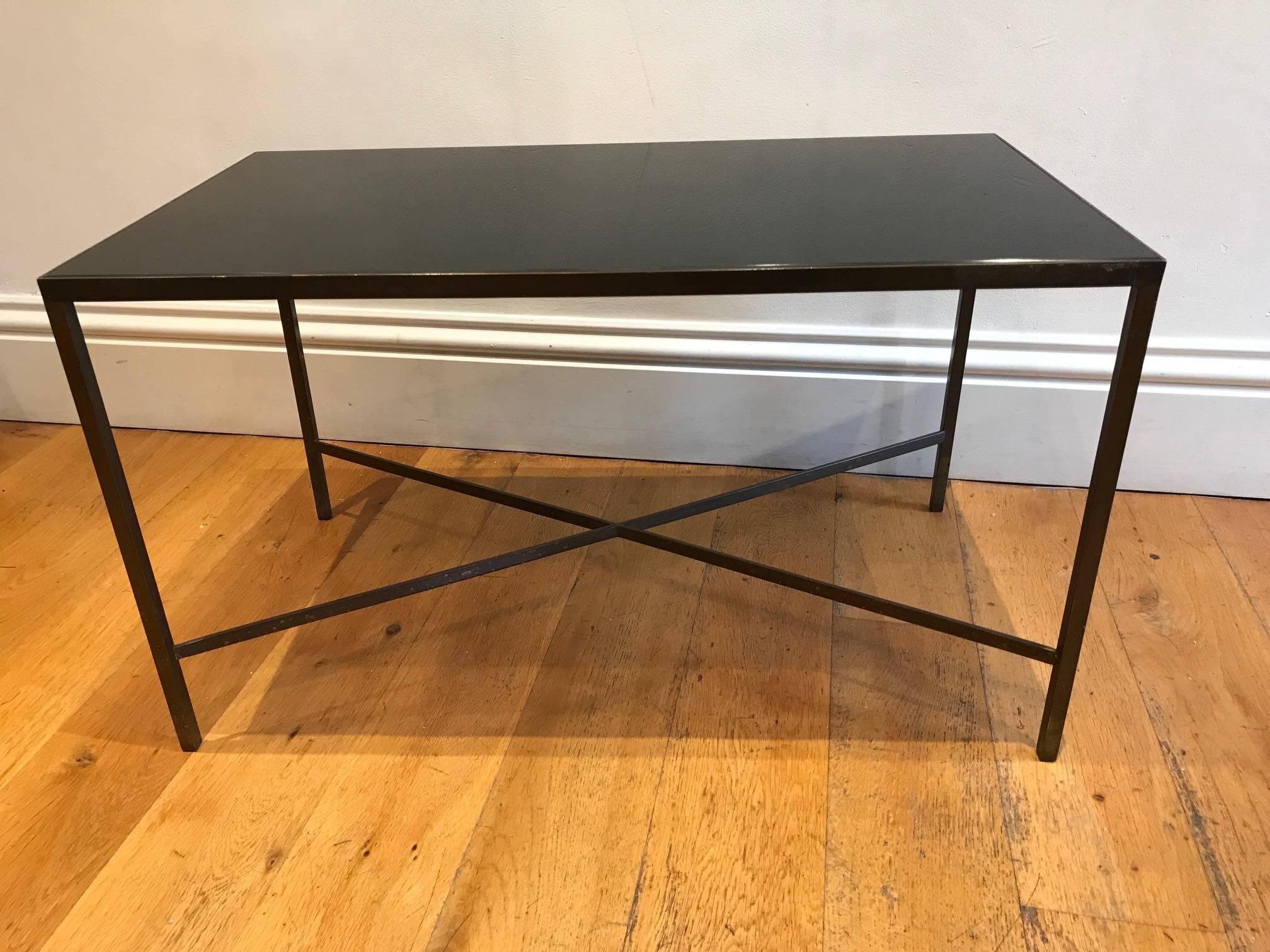 An elegant simple French small bronze metal coffee table with replaced black glass top.
 