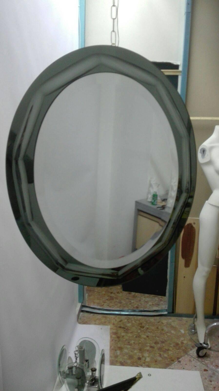 Mirror, Antonio Lupi. Vintage Italian oval, all glass mirror crystal Wolves Luxor (Antonio Lupi). The main dish bevelled glass is mounted on a smoked oval frame silver colored glass. It can be hung horizontally or vertically.
