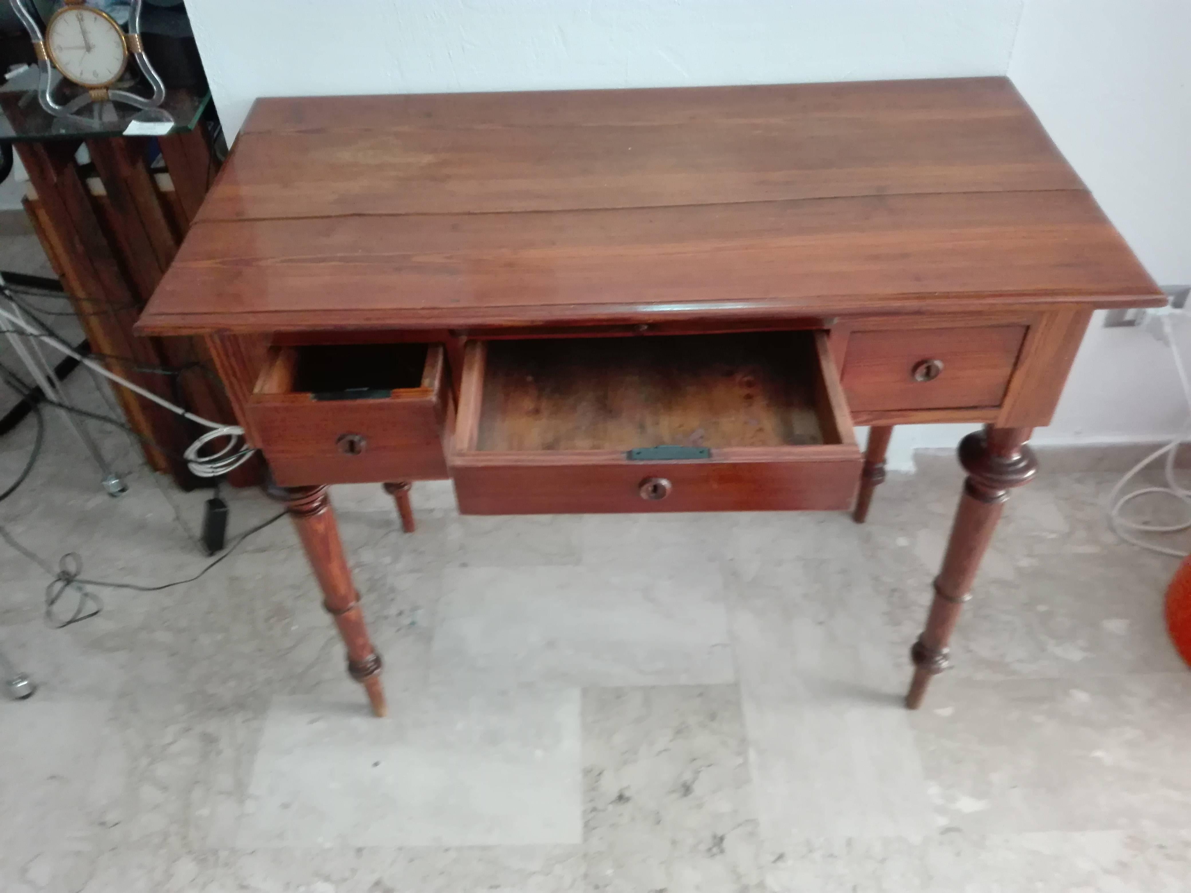 The writing desk and compound. The top with angled corners, long central drawer side with two drawers. Raised on legs. Condition: A bit of scratch and a chip at the top end.
