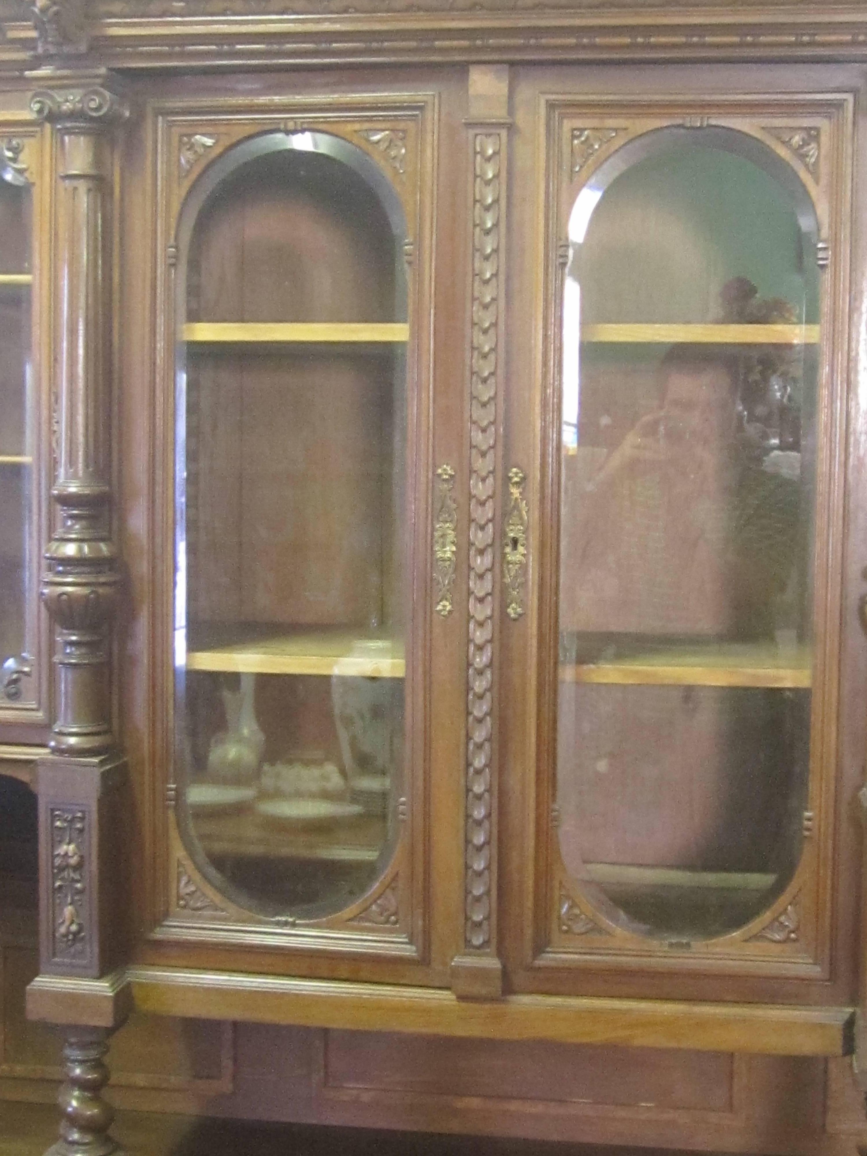 Glass 19th Century European Carved Walnut Breakfront with Burled Detail For Sale