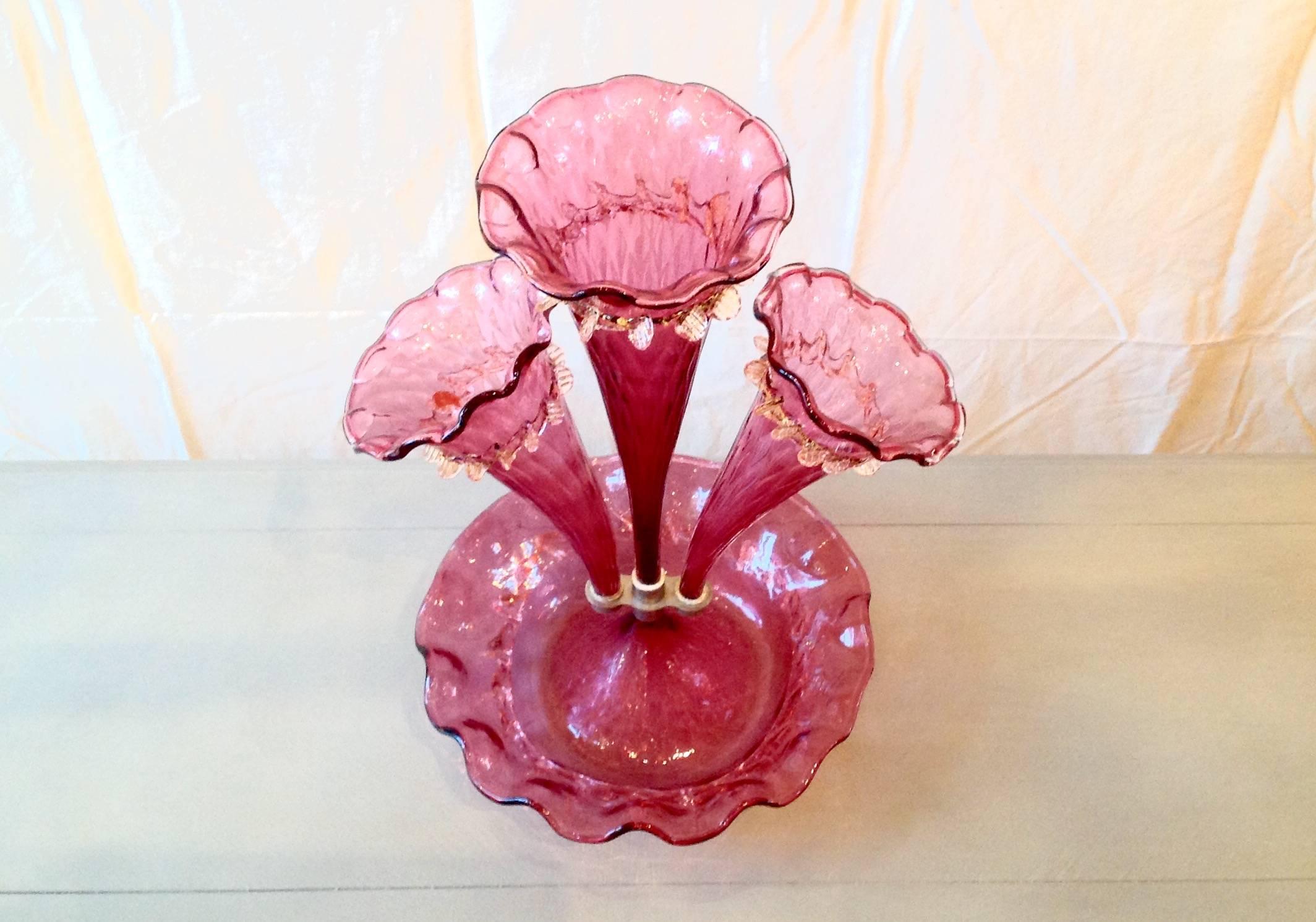Antique cranberry Italian Murano art glass epergne centerpiece vase, typically used for holding fruit or flowers.