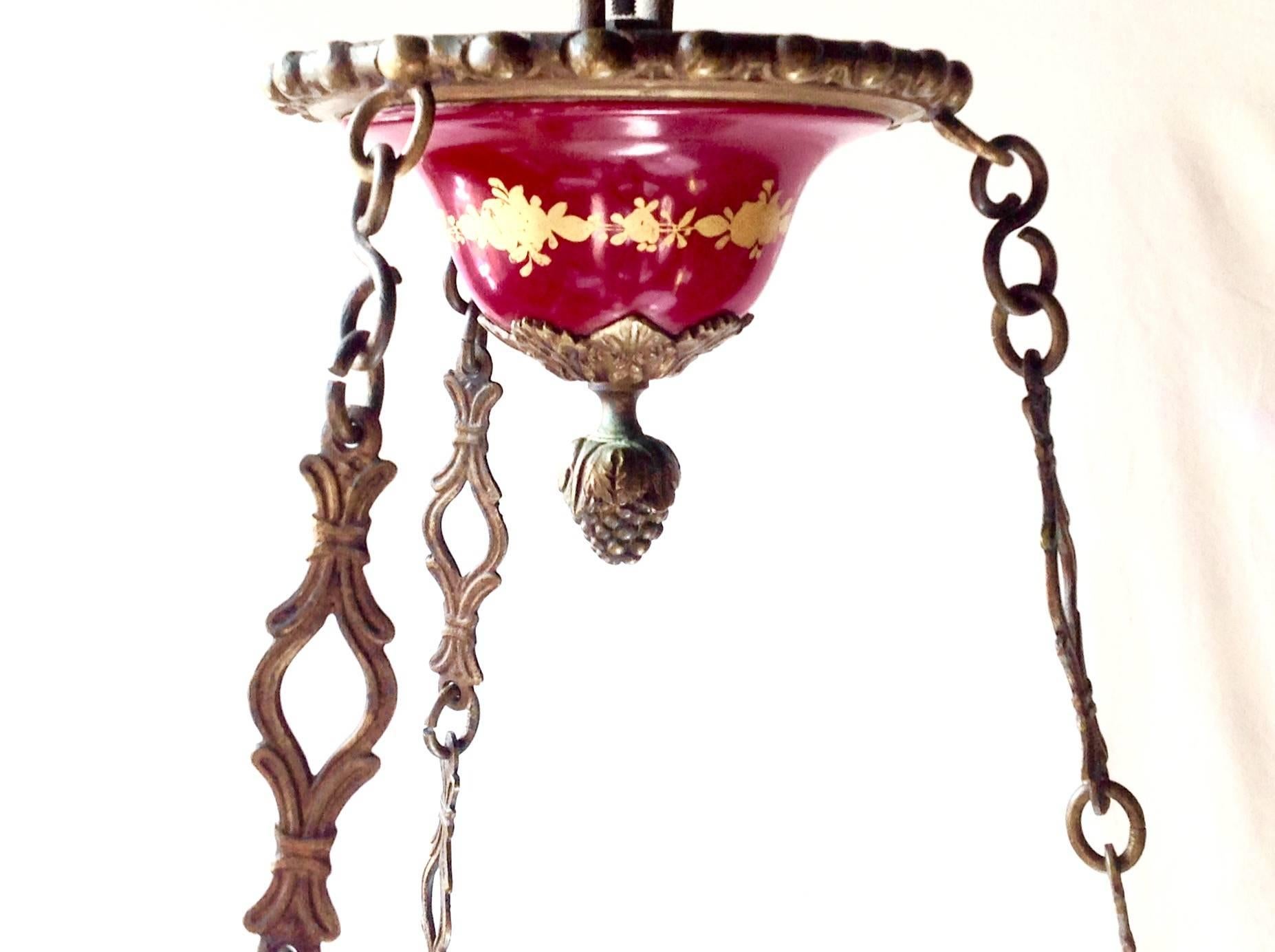 Early 1800s French Sèvres porcelain Regency Empire chandelier, nine lights, bronze or brass arms, originally candle, has been electrified. Can be restored to UL Wiring. Measures 30 inches high and 20 inches wide.
