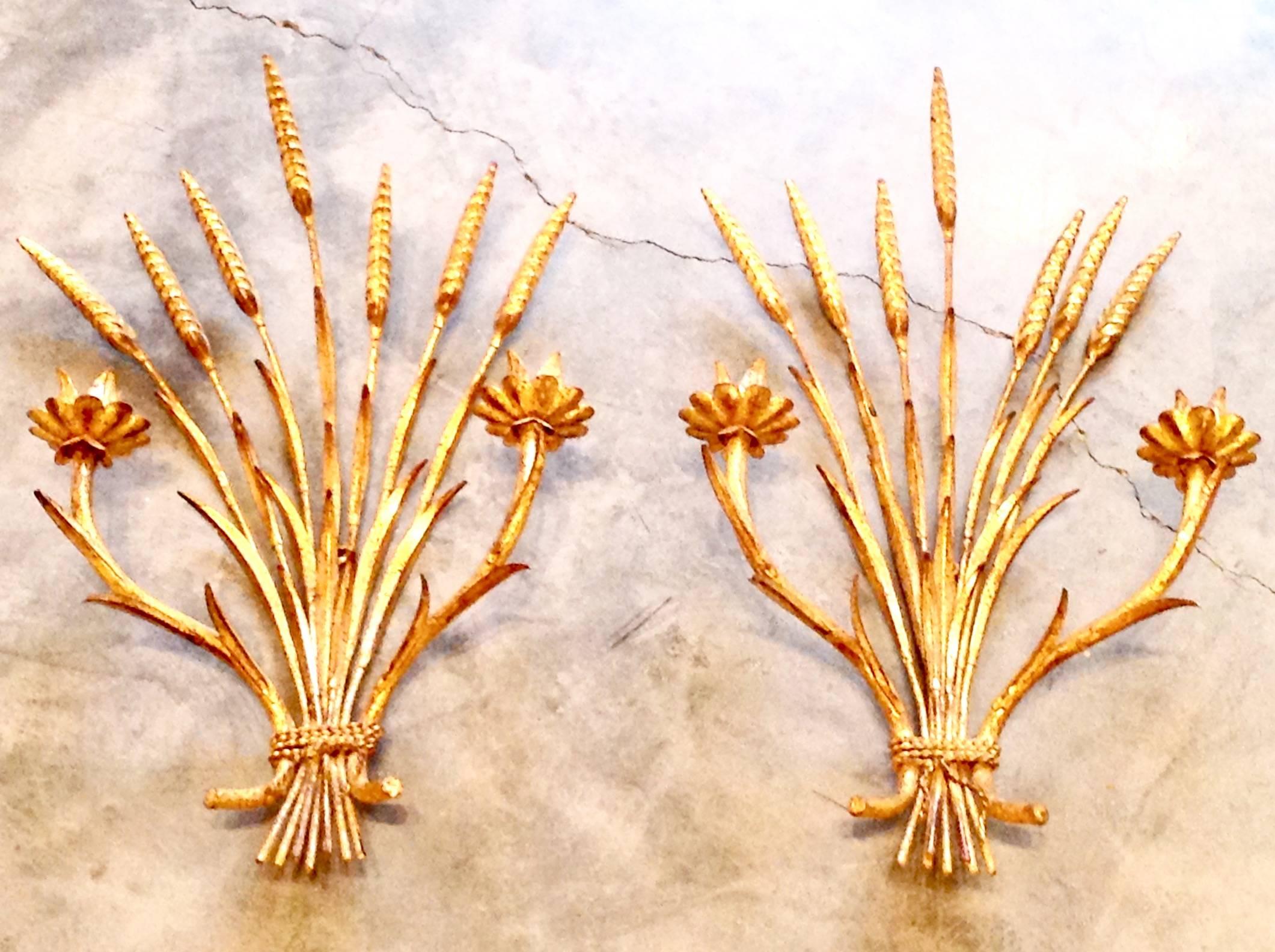 Pair of vintage Italian tole wheat sconces, circa 1950s. Iron with gold finish. Measure 17 inches high and 11 inches wide.