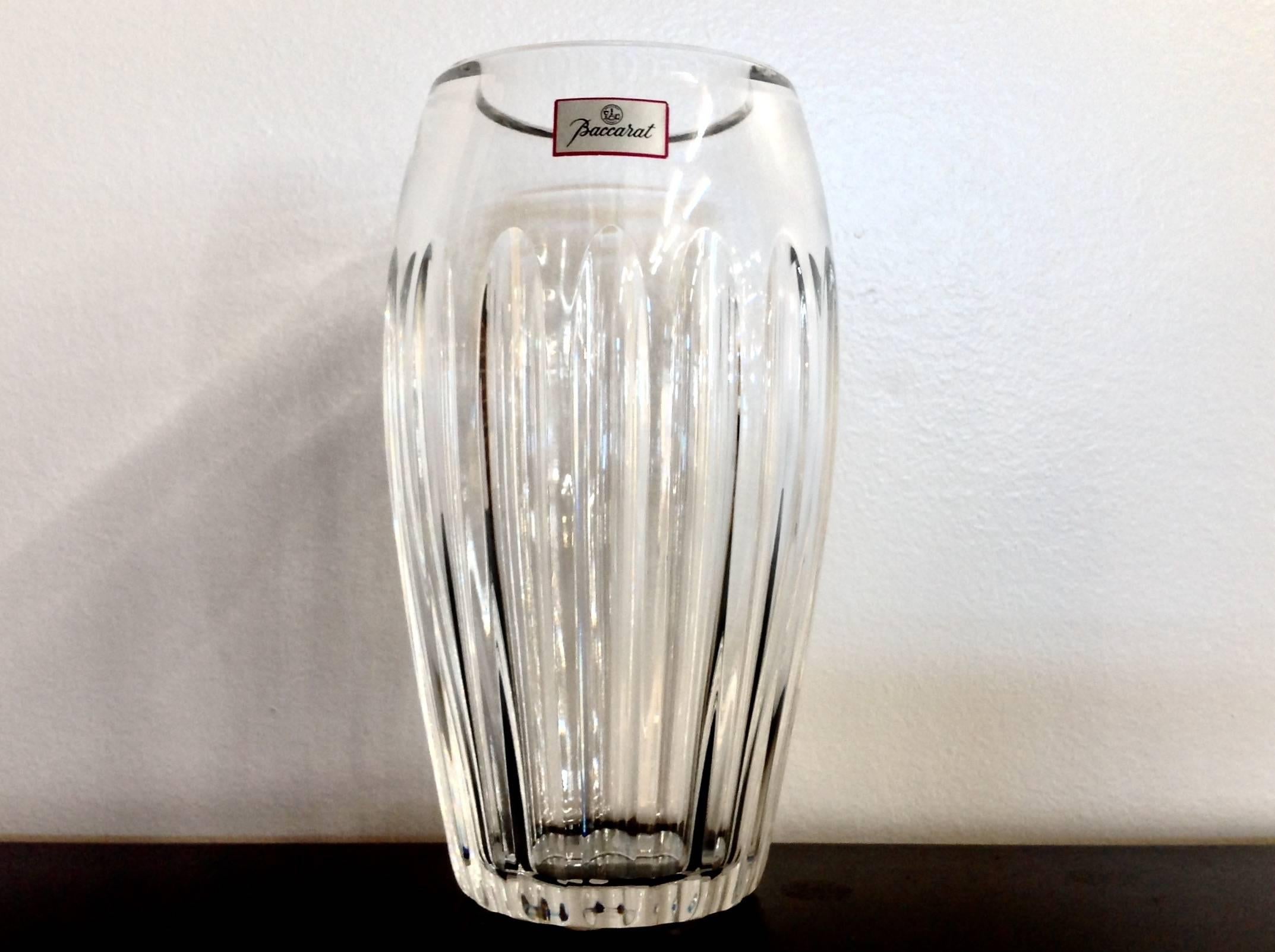 Beautiful flower vase in the Acropole pattern by Baccarat crystal. In excellent condition, comes with original red Baccarat box. Acid-etched Baccarat mark on bottom. Measures 8 inches tall and about 5 inches wide.