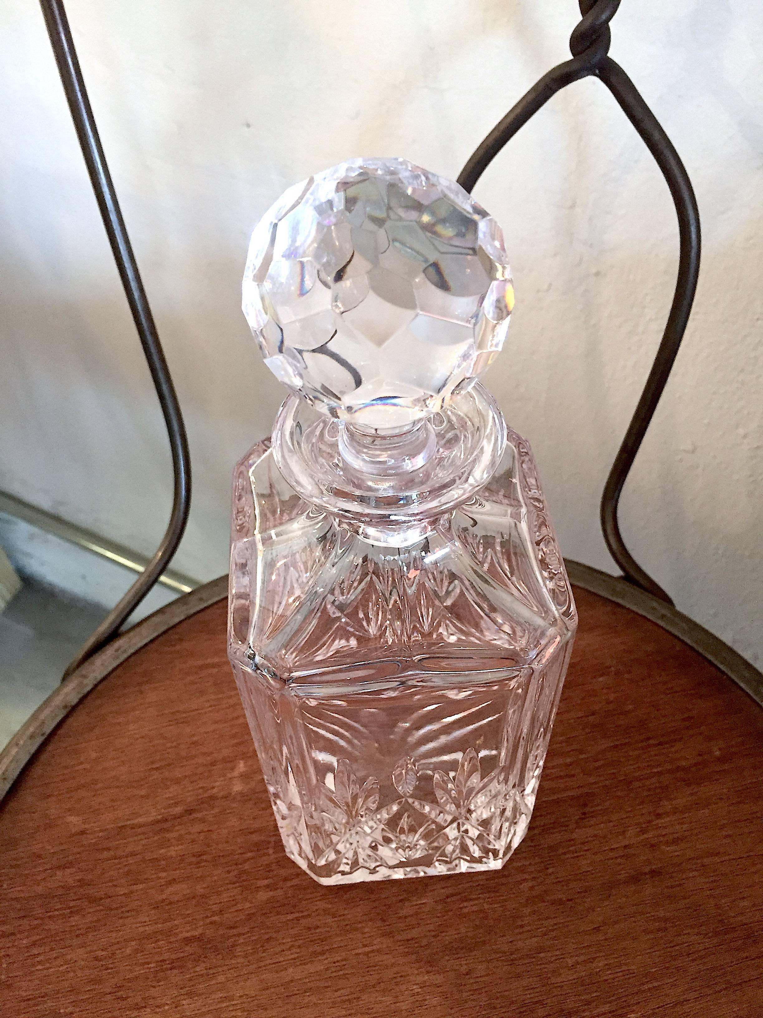 Beautiful cut crystal square decanter and stopper in Sybil pattern by Tiffany & Co. 
Measures 10 inches high and 3.5 inches wide.
Etched on bottom with Tiffany and Company signature.