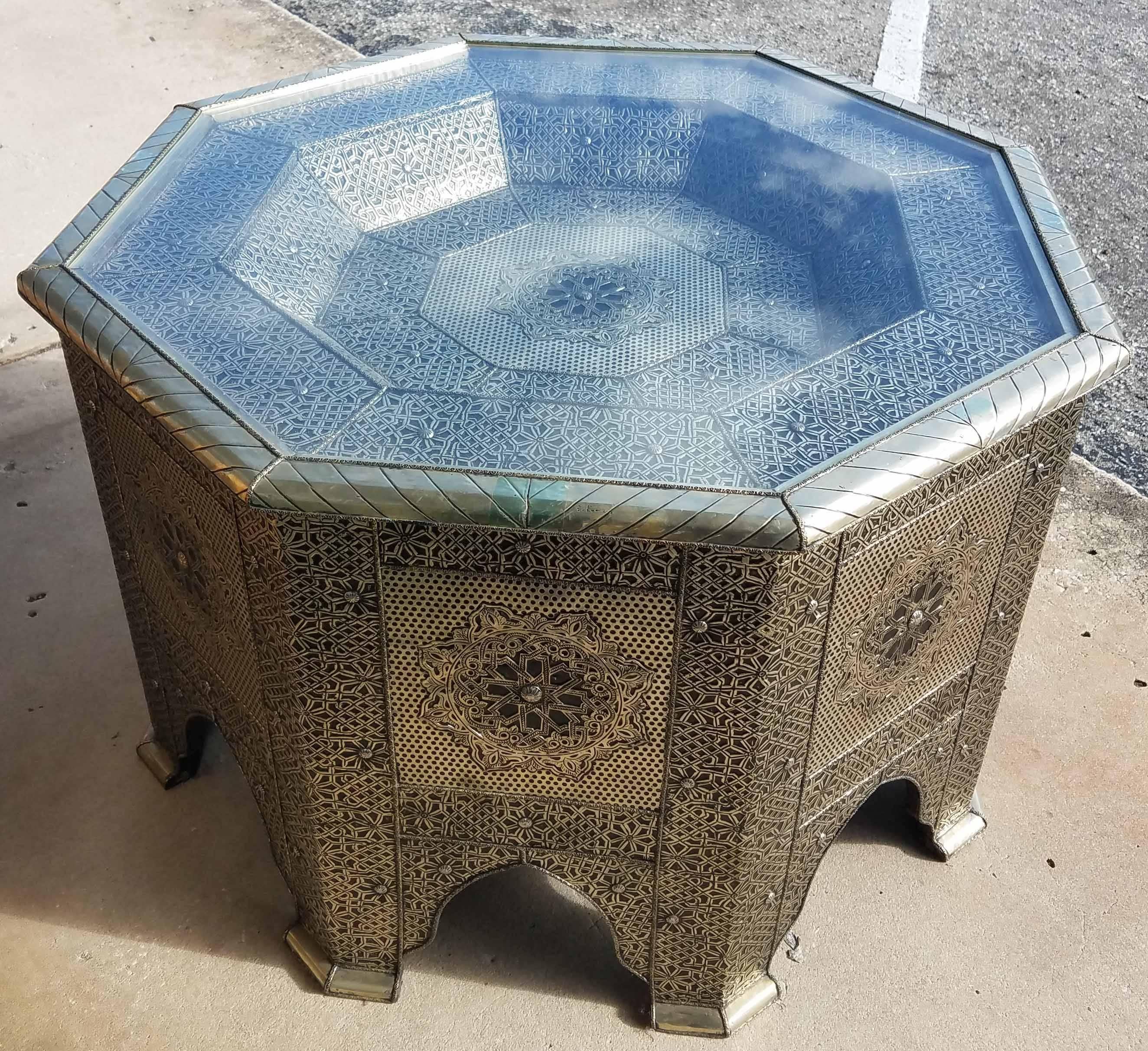 Very exotic all metal inlaid Moroccan side table. Octagonal shape for a better / attractive look. With its detailed carving along the sides and the top, this side table will sure be a excellent add-on to your décor. It measures approximately 21” in