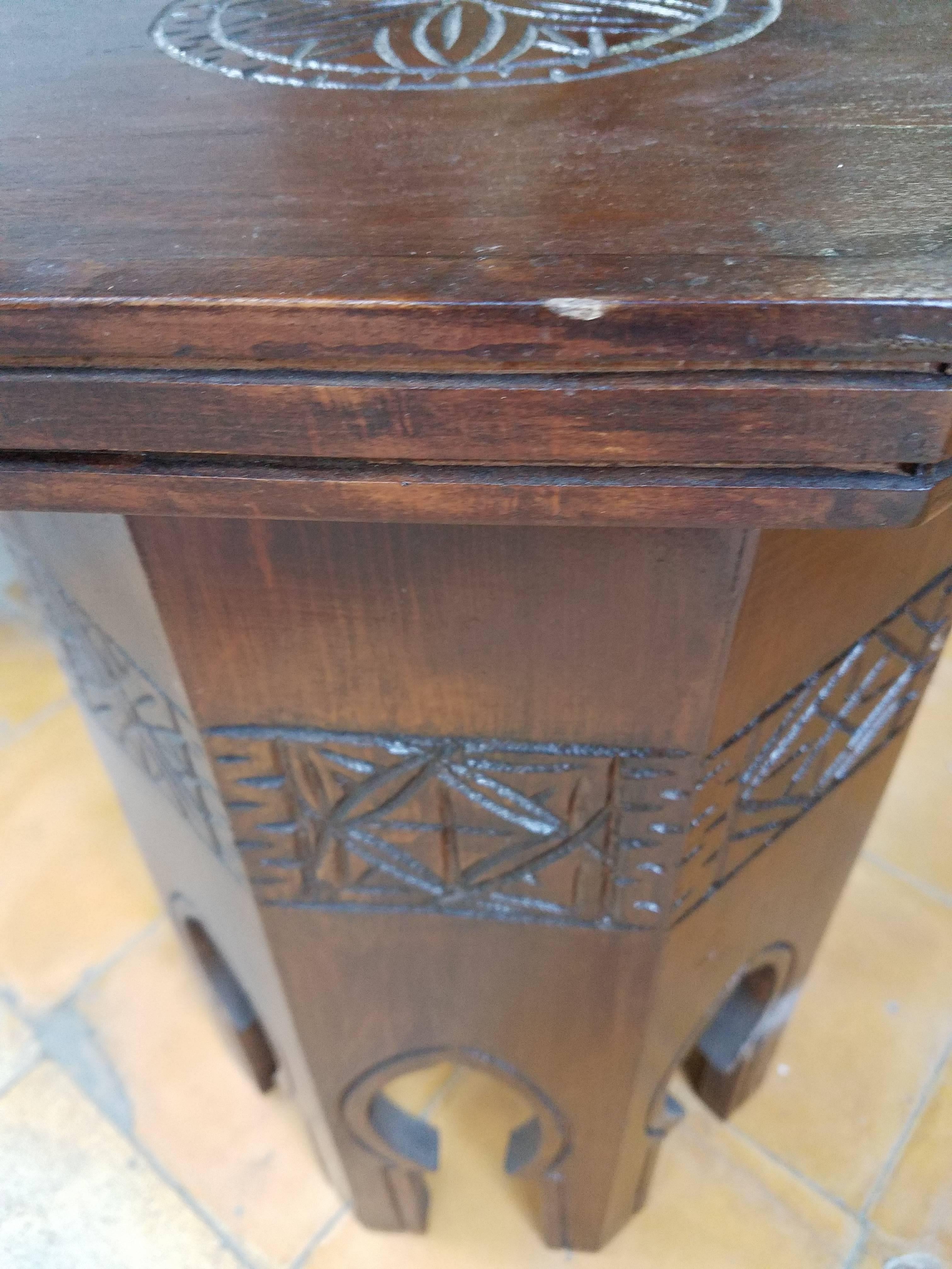 Handmade and hand-carved octagonal Moroccan wooden side table, measuring 15