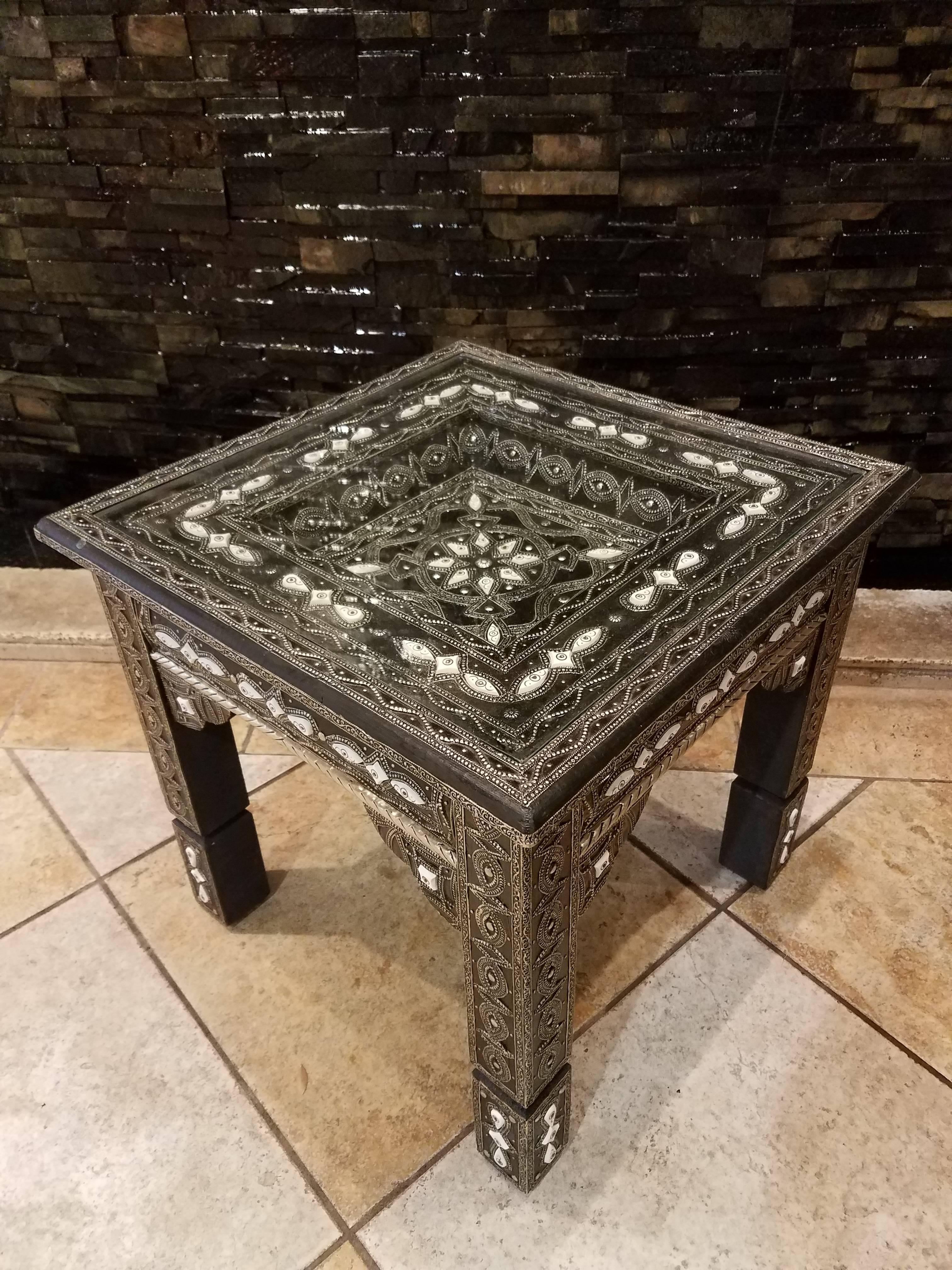 One of the best Moroccan side tables to ever make it to our warehouse. New square style inlaid with metal and camel bone. This table measures approximately 21″ from side to side and 20″ in height. Weighs about 25 lbs. Very intricate as you can see