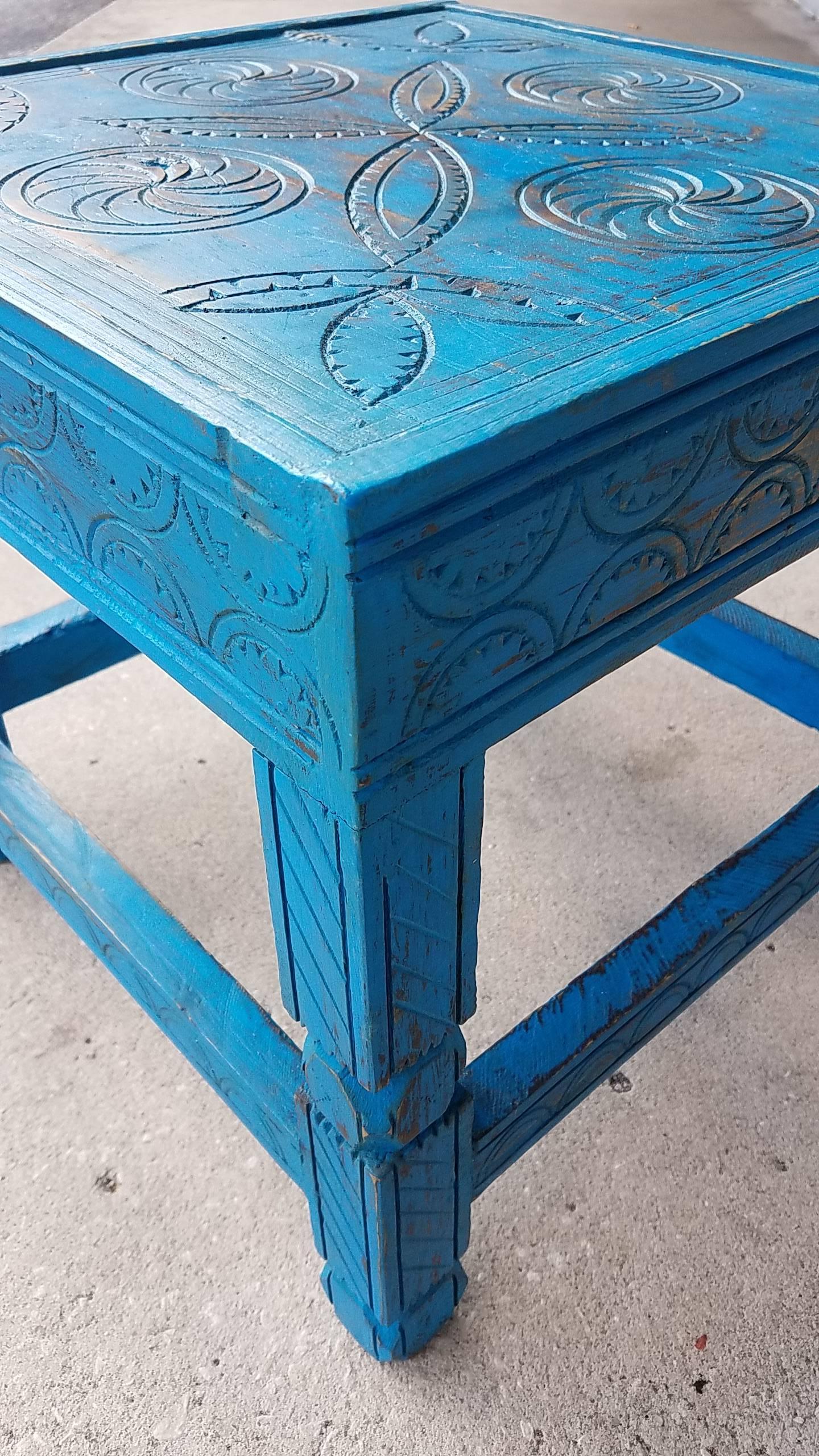 This is a beautiful Moroccan side table made of aged cedar wood, and painted in a rare dark turquoise color. Also available in off-white, burnt burgundy, and light turquoise. This amazing table measures approximately 16