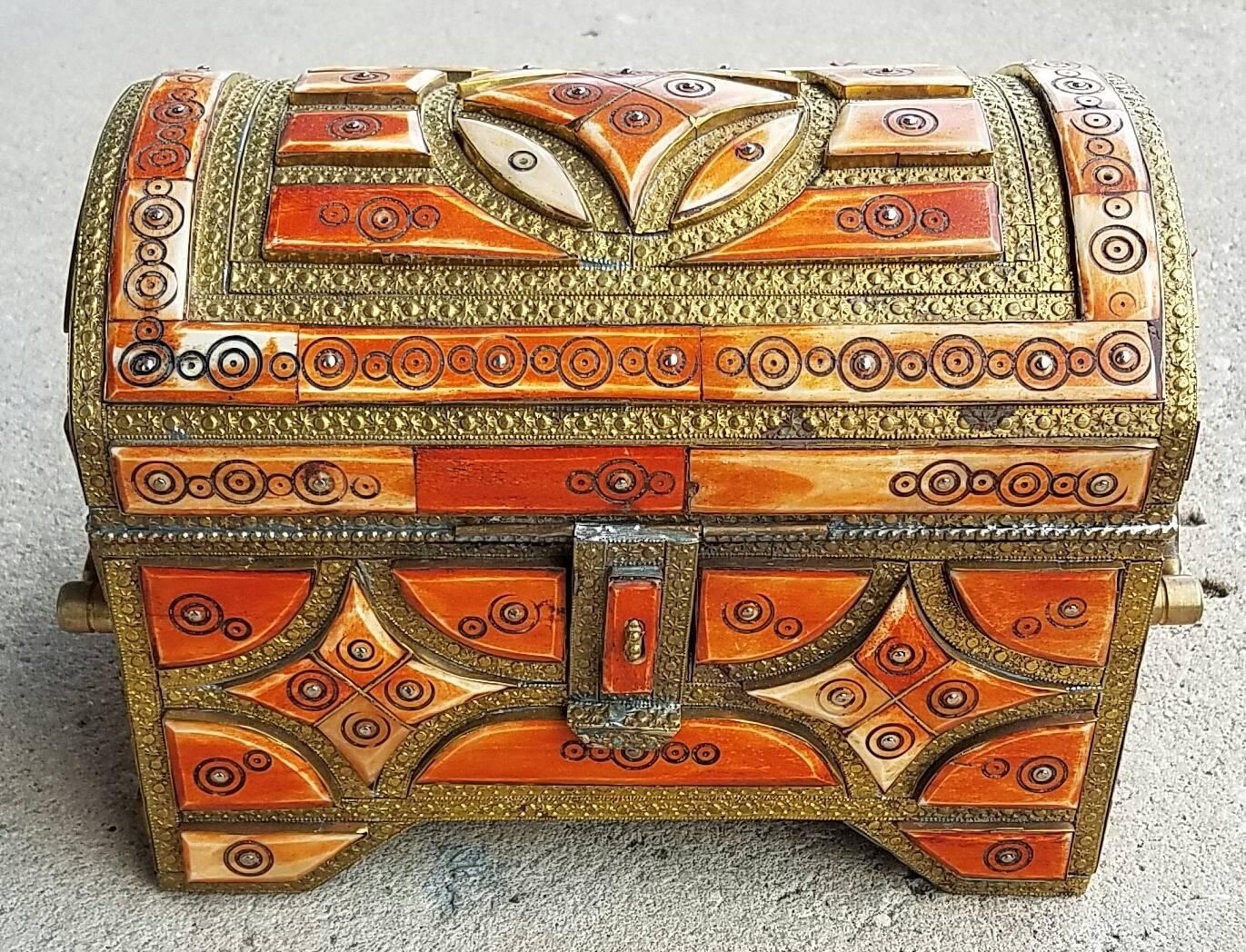 A beautiful Moroccan camel bone trunk from Marrakech. Camel bone dyed in henna mixed with metal inlaid makes this trunk a great addition to any decor. Measuring approximately 10