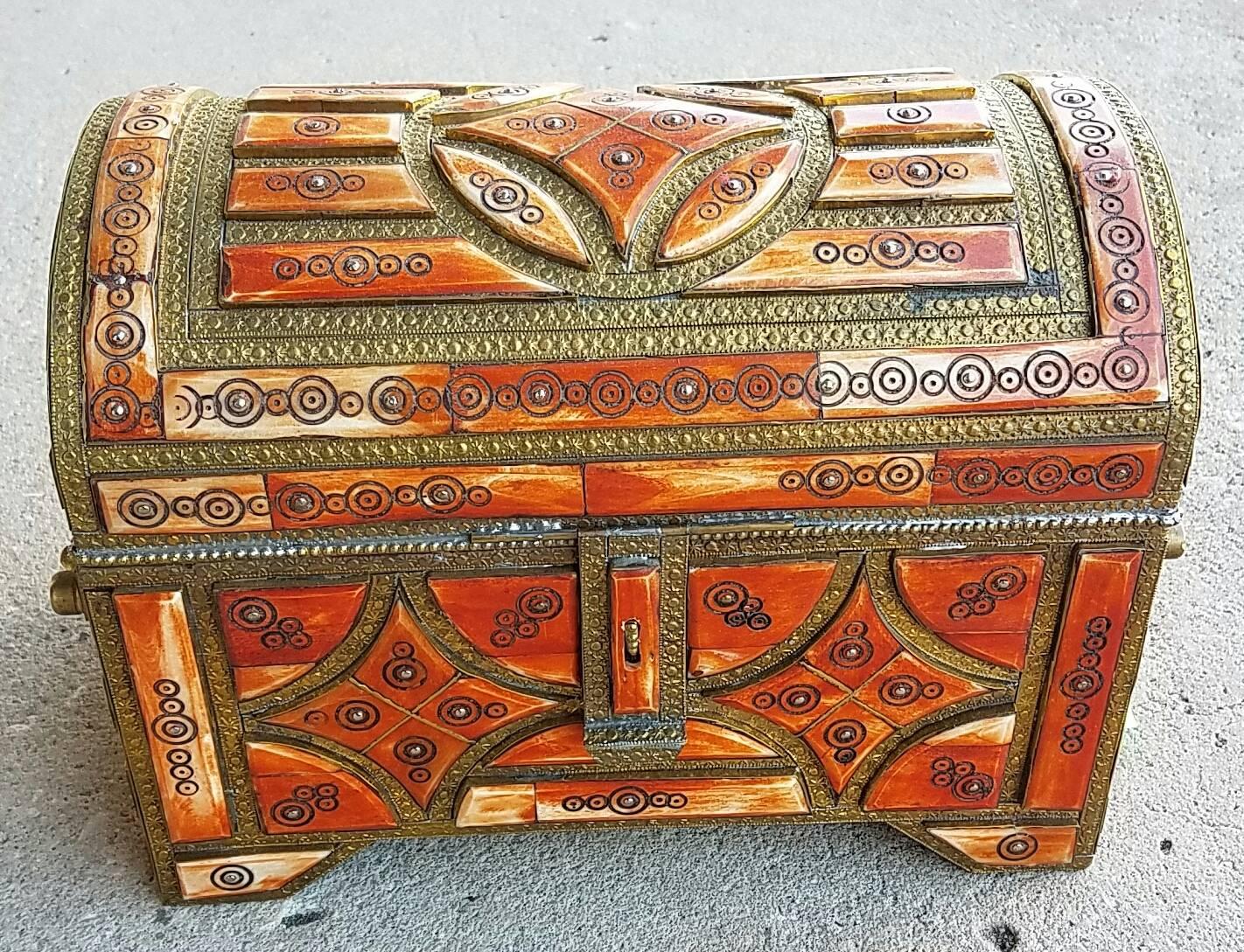A beautiful Moroccan camel bone trunk from Marrakech. Camel bone dyed in Henna mixed with metal inlaid makes this trunk a great addition to any decor. Measuring approximately 12