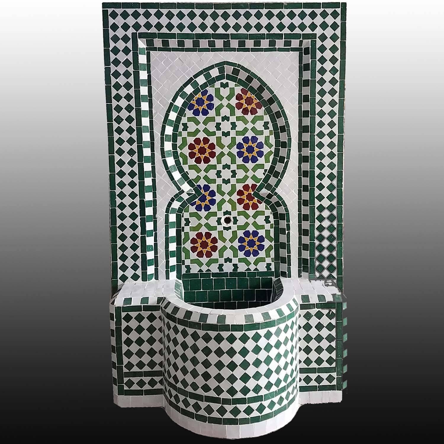 Very typical colorful Moroccan mosaic fountain handmade in Morocco. This fountain is usually found in courtyards and Riads all over Morocco. It measures approximately 40? high and 26? wide and weighs about 200 lbs. Boar's head copper spout is