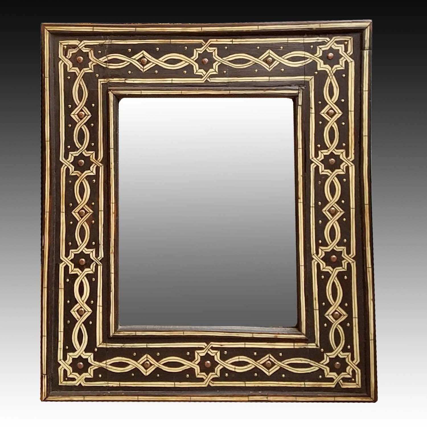New arrival. New model. An amazing camel bone and metal inlaid mirror from Morocco. Just another amazing piece of work from Marrakech. Very elegant and chic looking. It measures approximately 25