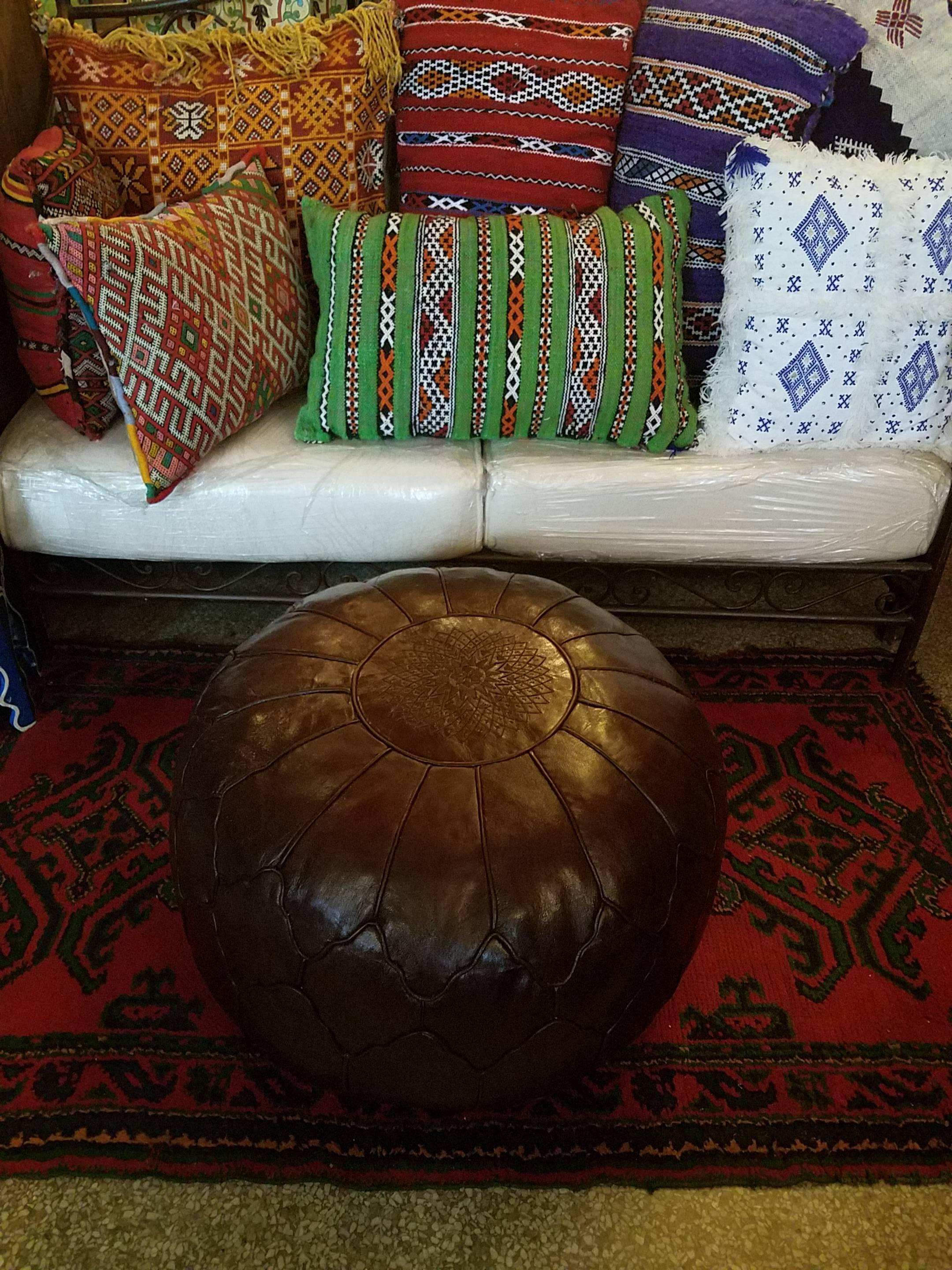 Poufs and ottomans have been around for a very long time, as many cultures prefer low seating for meals and family gatherings. We, at Living Morocco, carry a wide variety of leather poufs and ottomans, fabric hassocks and leather camel