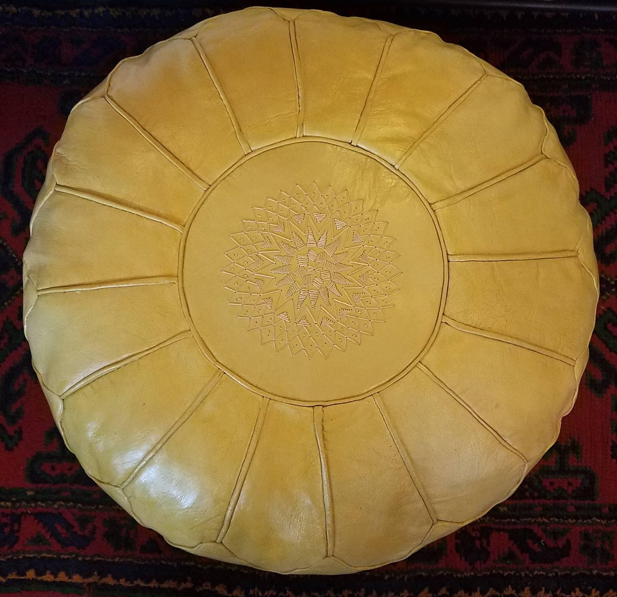 Poufs and ottomans have been around for a very long time, as many cultures prefer low seating for meals and family gatherings. We, at Living Morocco, carry a wide variety of leather poufs and ottomans, fabric hassocks, and leather camel