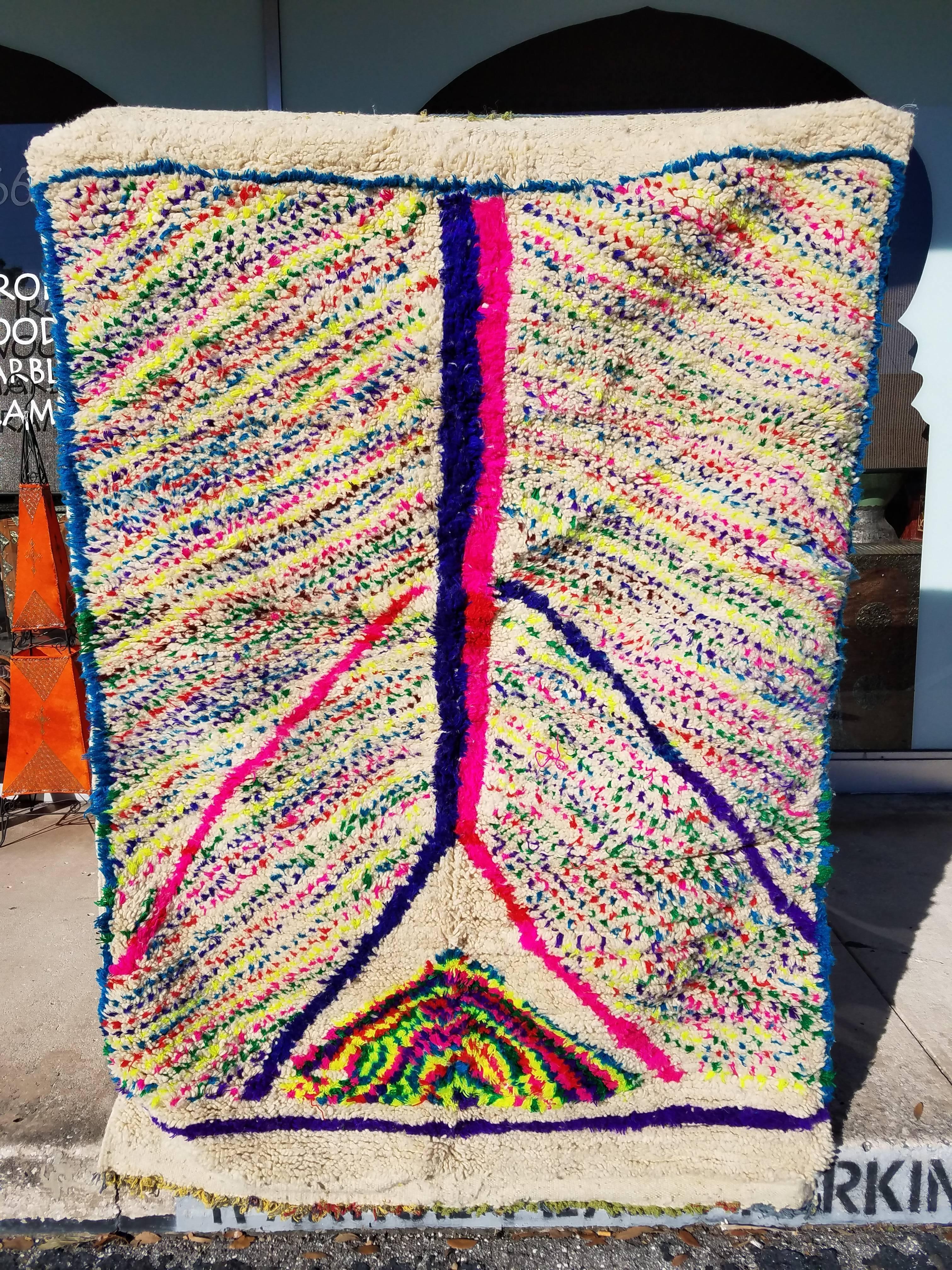 A unique and hard to find multicolor rug form Bejaad - also known as Boujaad – in the Middle Atlas Mountains of beautiful Morocco. Measuring approximately 6’2” x 4’2”, and adorned with beautiful patches of neon greens, yellows, pinks, and others.