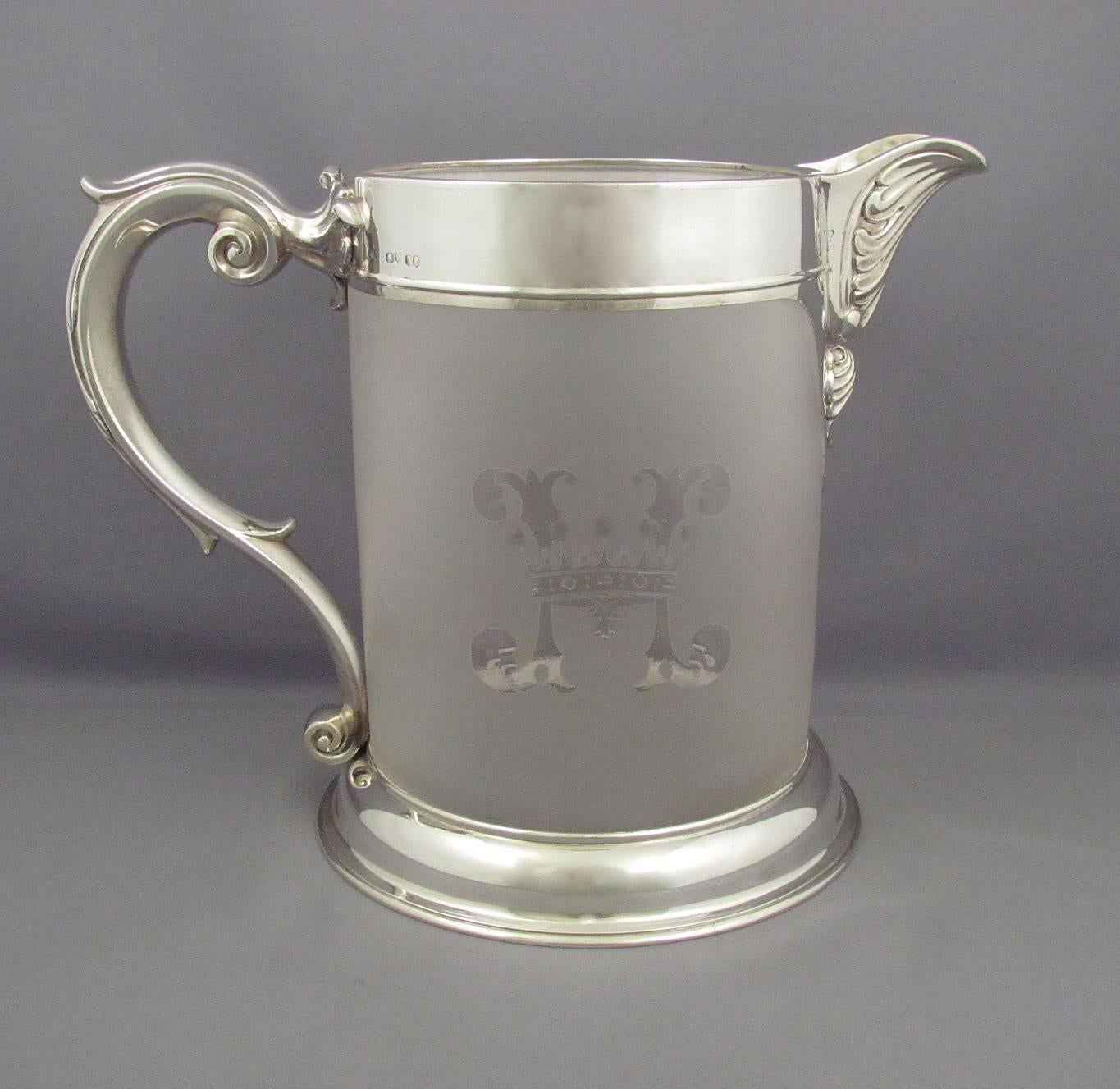 A rare and fine quality Victorian sterling silver and frosted glass beer jug with two matching mugs by John Figg, London, 1855-1857. Each piece engraved with an H and a coronet. Measures: 9" (22.9cm) high.