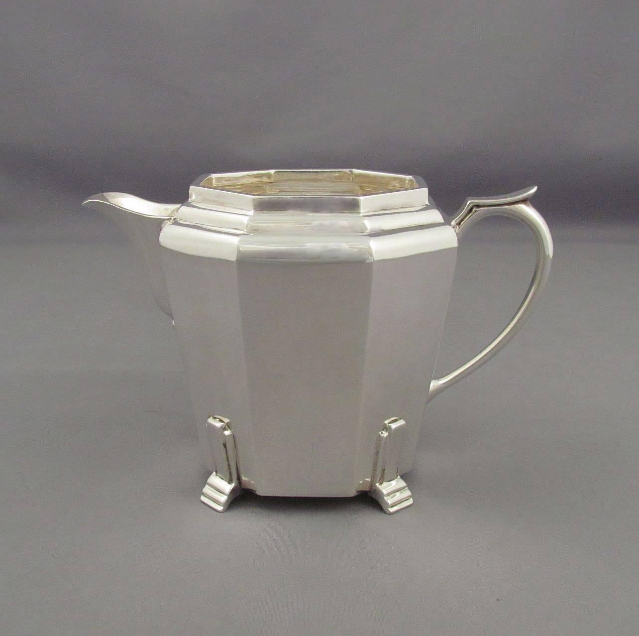 A handsome English sterling silver tea service in the Art Deco style hallmarked Sheffield 1938 by Thomas Bradbury & Sons. Fine quality and good weight. Teapot is 10"(25.5cm) from spout to handle and has a four cup (one litre) capacity,