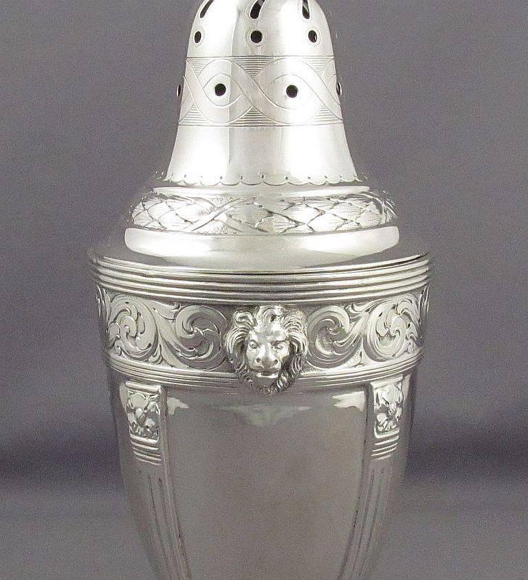 A massive and fine quality Danish .830 silver sugar caster, circa 1900. Neoclassical style, urn shaped body on four legs with paw feet, decorated with lion's masks, acanthus and scrolls. Measures: 9 3/4