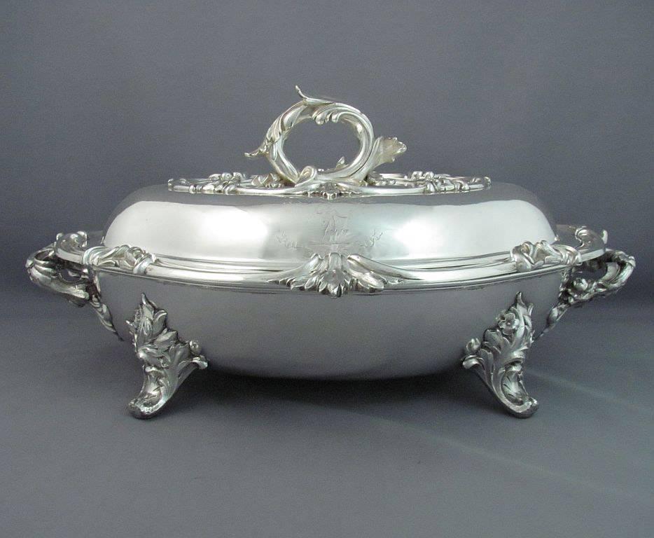 A pair of large and fine quality early Victorian sterling silver entree dishes by William Ker Reid, hallmarked London 1837. Cushion shaped with applied and chased scroll and acanthus borders and beautifully chased scrolling vine handles, with the