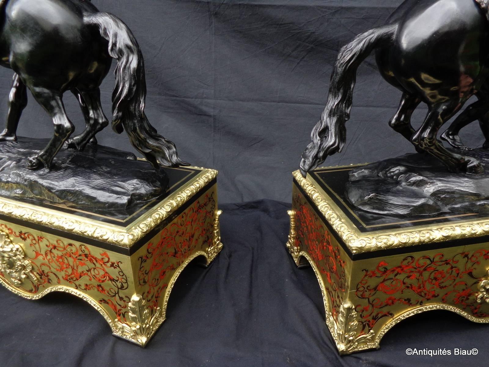 Spectacular and rare pair of Marly Horses on their pedestal Boulle marquetry,
19th century.
 
The color is superb: Black medal.
 
A true pair of the exceptionally fine, of quality and detail.
 
bronzes are numbered 1 and 2.
 

Measures: