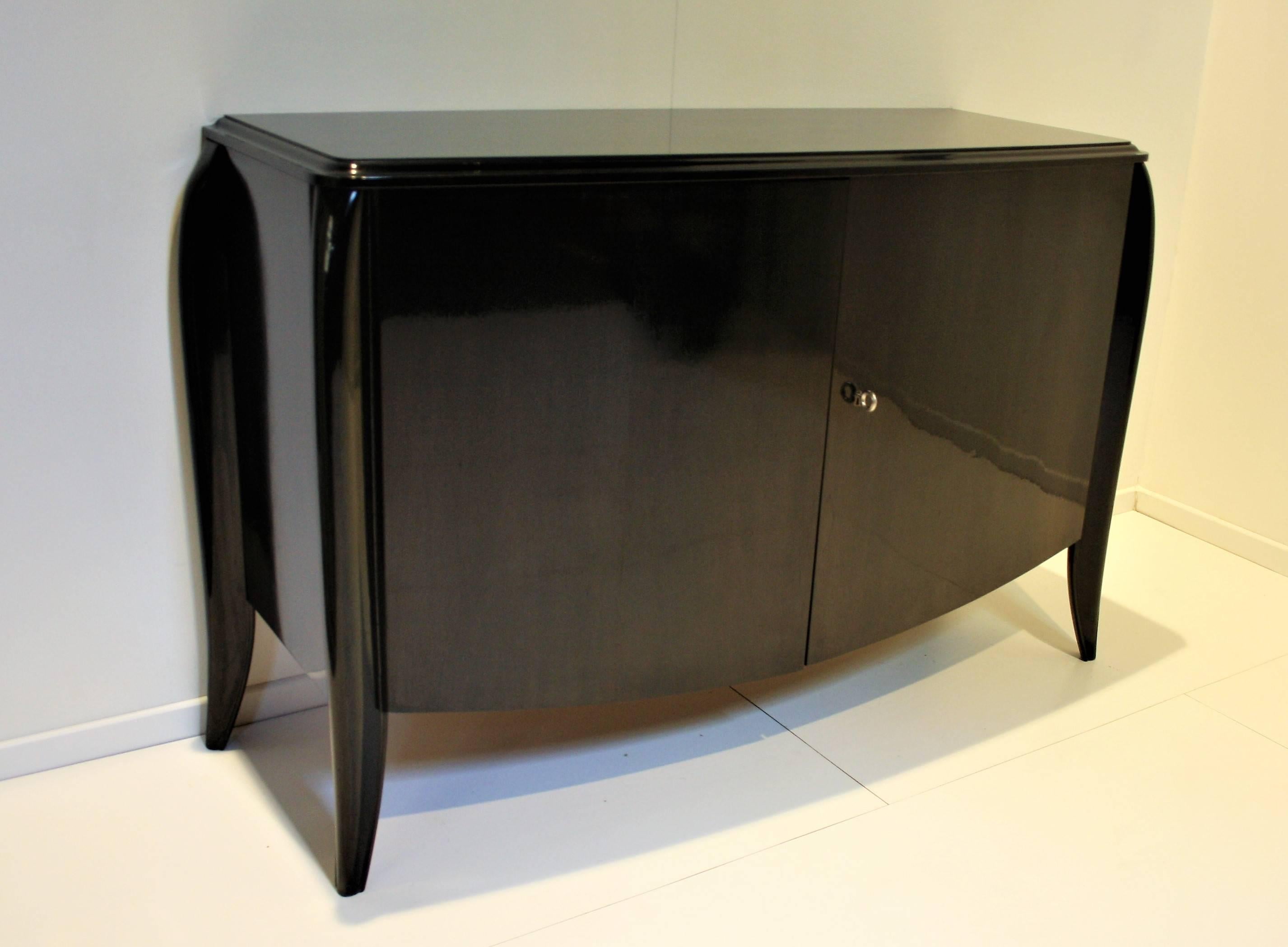 Elegant and refined French Art Deco sideboard in blackened wood from Dominique.
In very good condition with original polishing and patina.

 