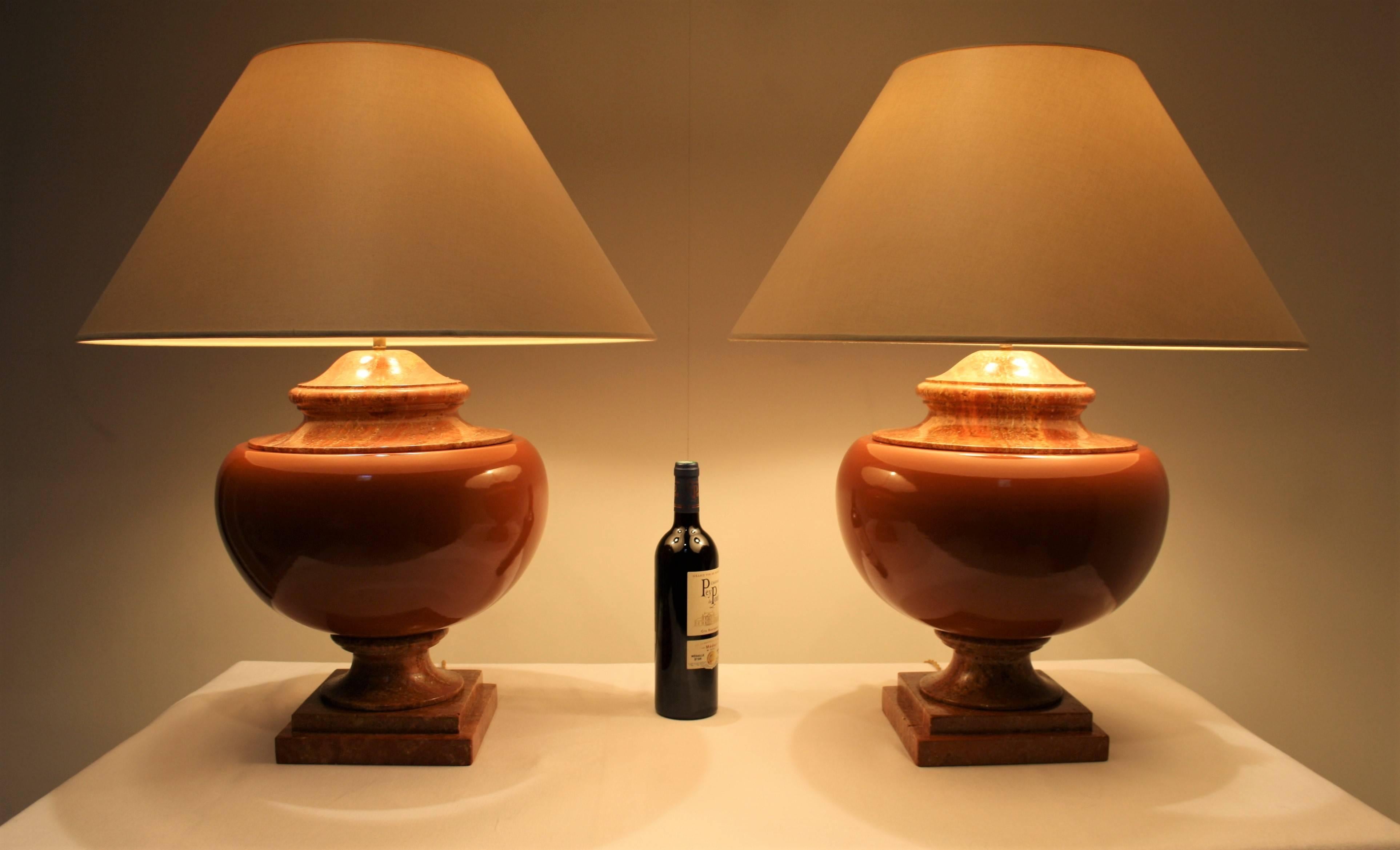 The foot and top are made of red travertine and the middle is made of enameled terracotta.
The lampshades are in ivory color in good condition, the dimensions are 23.6 inches (60 cm) diameter and 11.4 inches (29 cm) high.
They have been