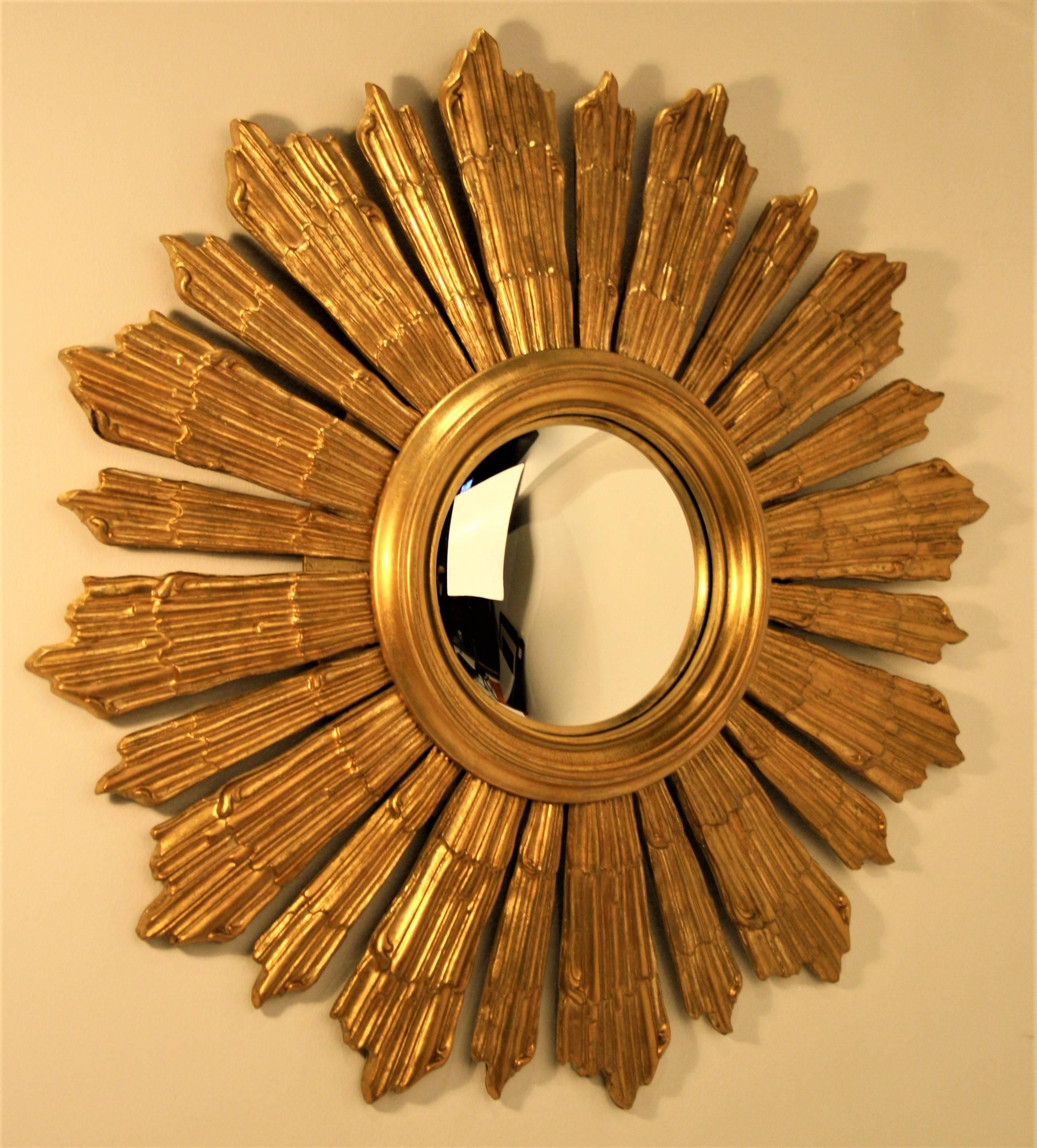A beautiful French giltwood sunburst mirror with a convex glass mirror from 1940s.