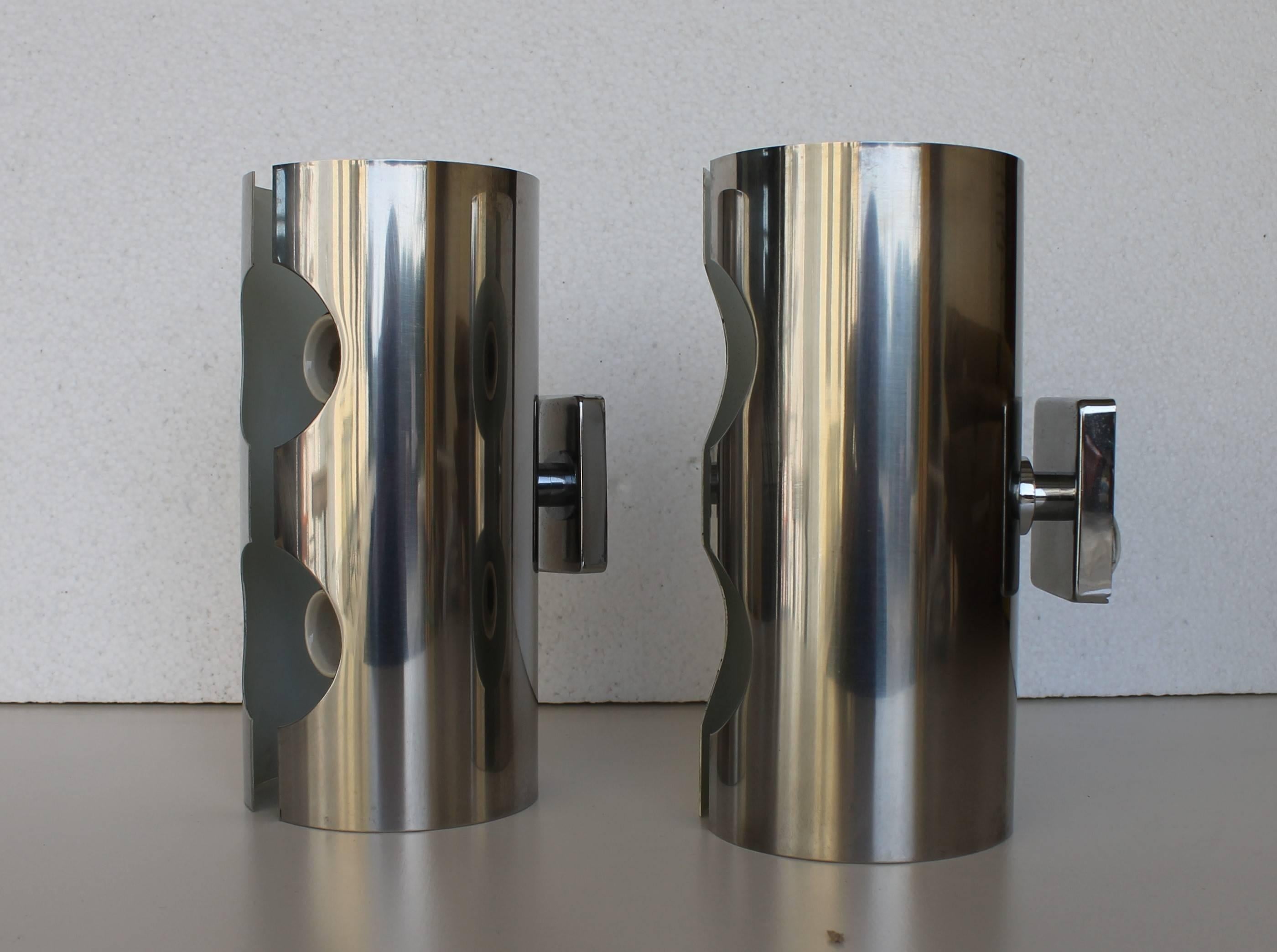 Two chromed metal sconces, made in Italy, dated circa 1970. Two lights each sconce.

Perfect conditions.