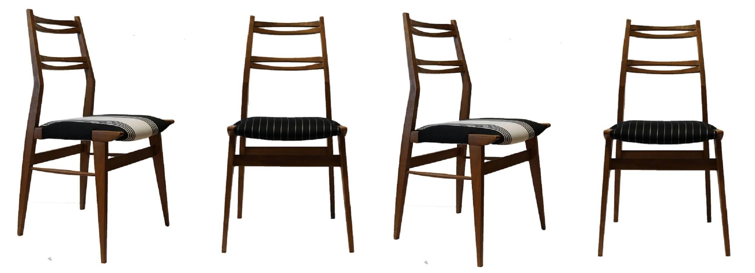 Four ash chairs in the manner of Carlo de Carli, dated late 1950s.
New stuffing and upholstery, two chairs for each textile.