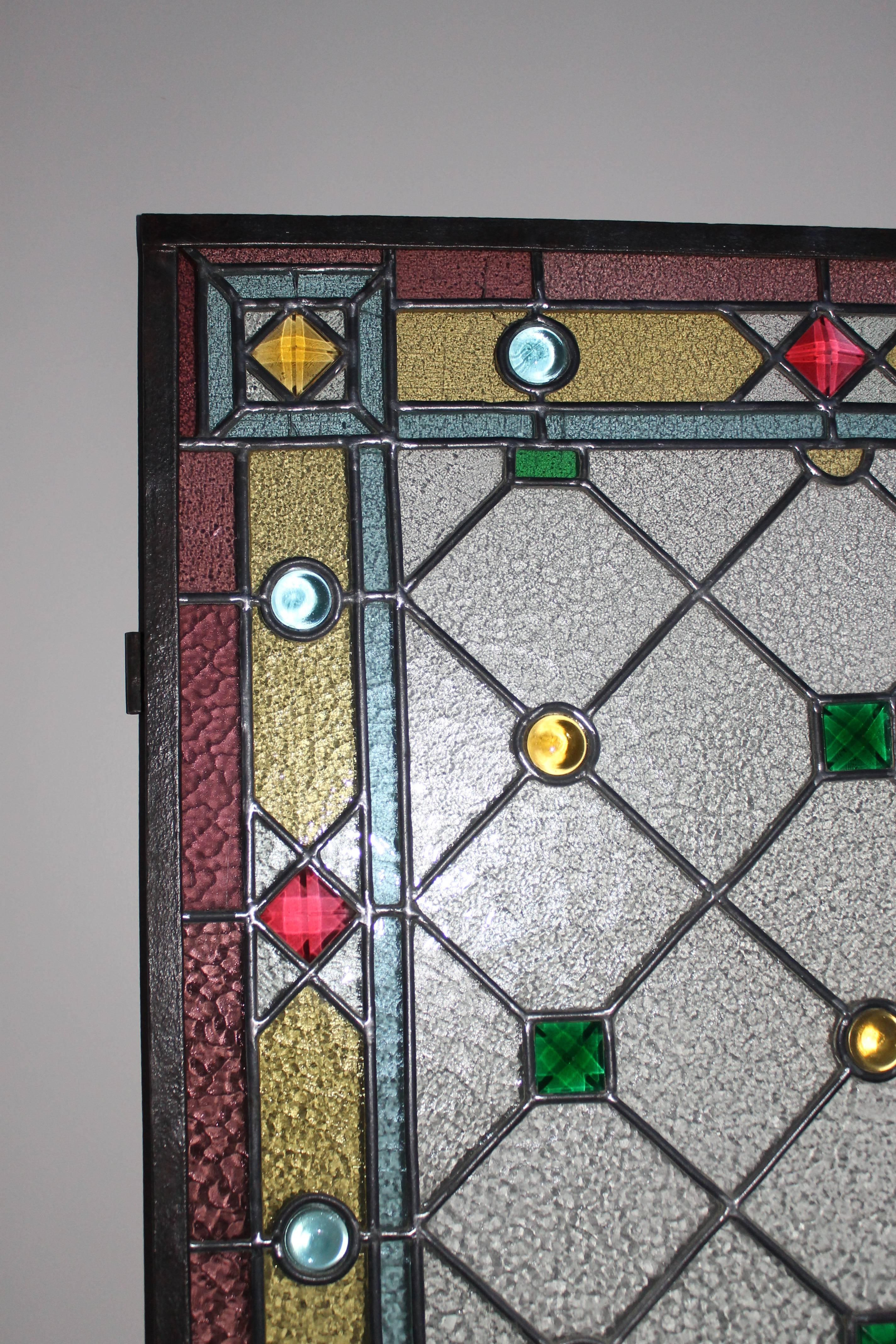 Two decorated stained glass panels, completely restored, dated, circa 1935.

Another pair available.