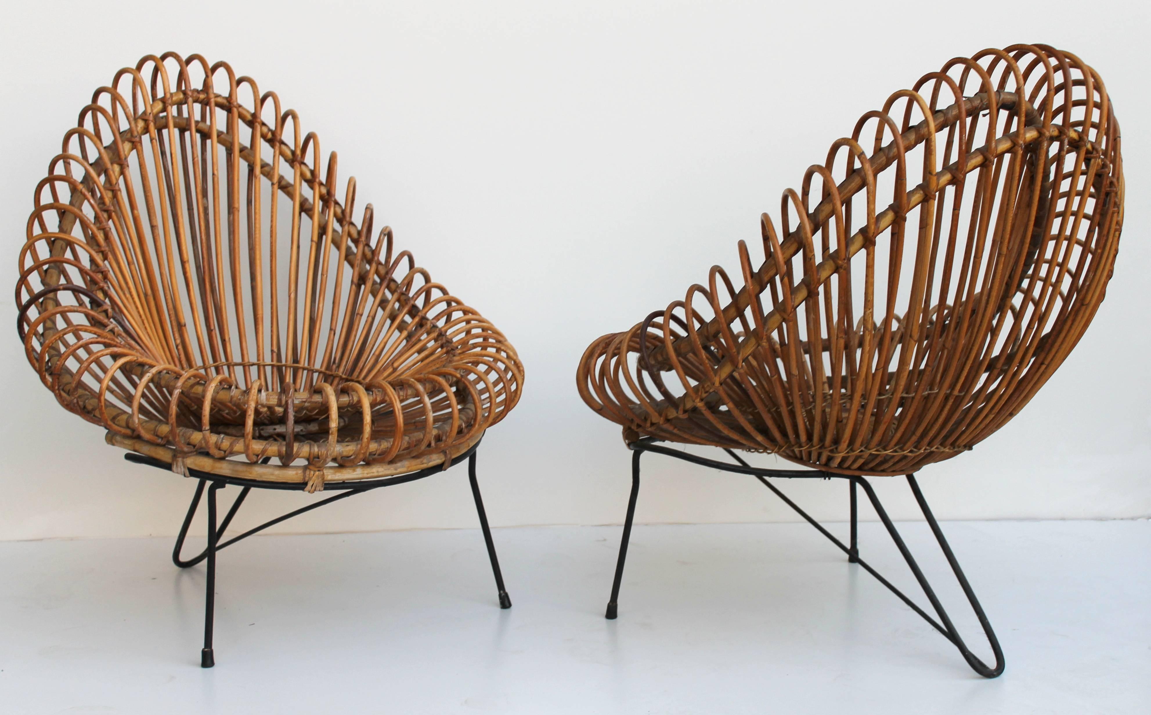 This basketware lounge chairs from 1955 is in good original condition, designed by Janine Abraham and Dirk Jan Rol. The elegant basket seat shell is held by black lacquered steel frame. Manufactured by Edition Rougier.

