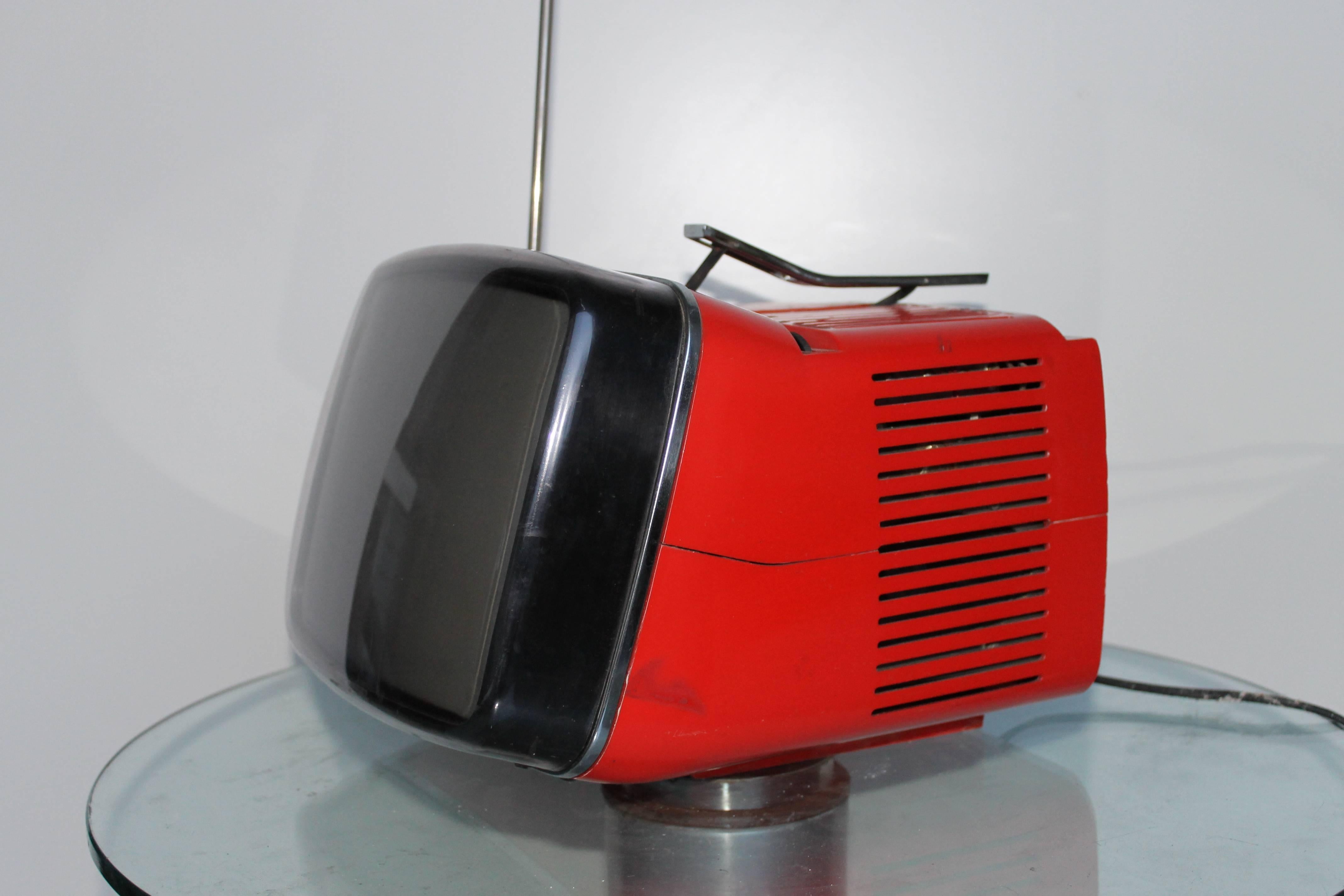 Red Algol 11 portable television by Marco Zanuso and Richard Sapper for Brionvega. A classic of Italian design. It needs some maintenance and a round antenna, but it works!