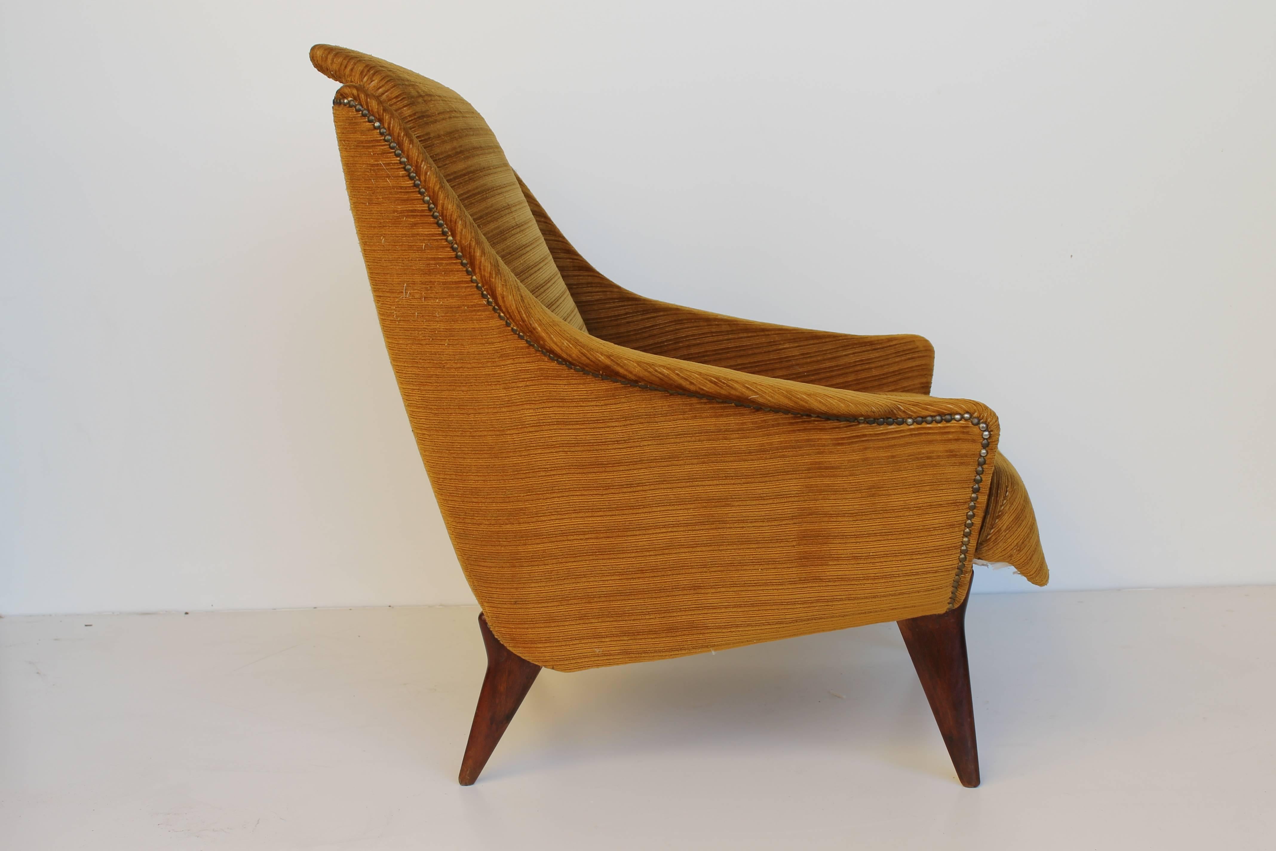 Beautiful armchair attributed to Isa, yellow velvet and teak feet. Dated circa 1950.