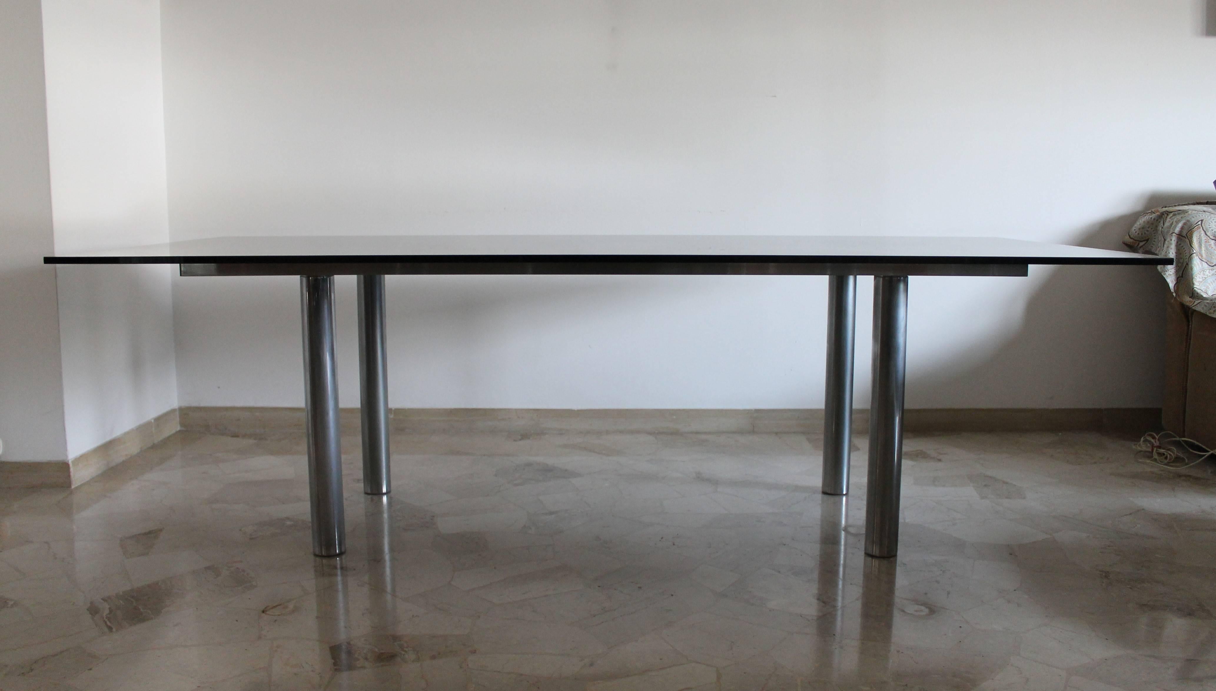 Andre dining table XL size designed by Tobia Scarpa for Gavina, dated 1970.

Smoked glass top on chrome structure.

Very small defect on glass top.