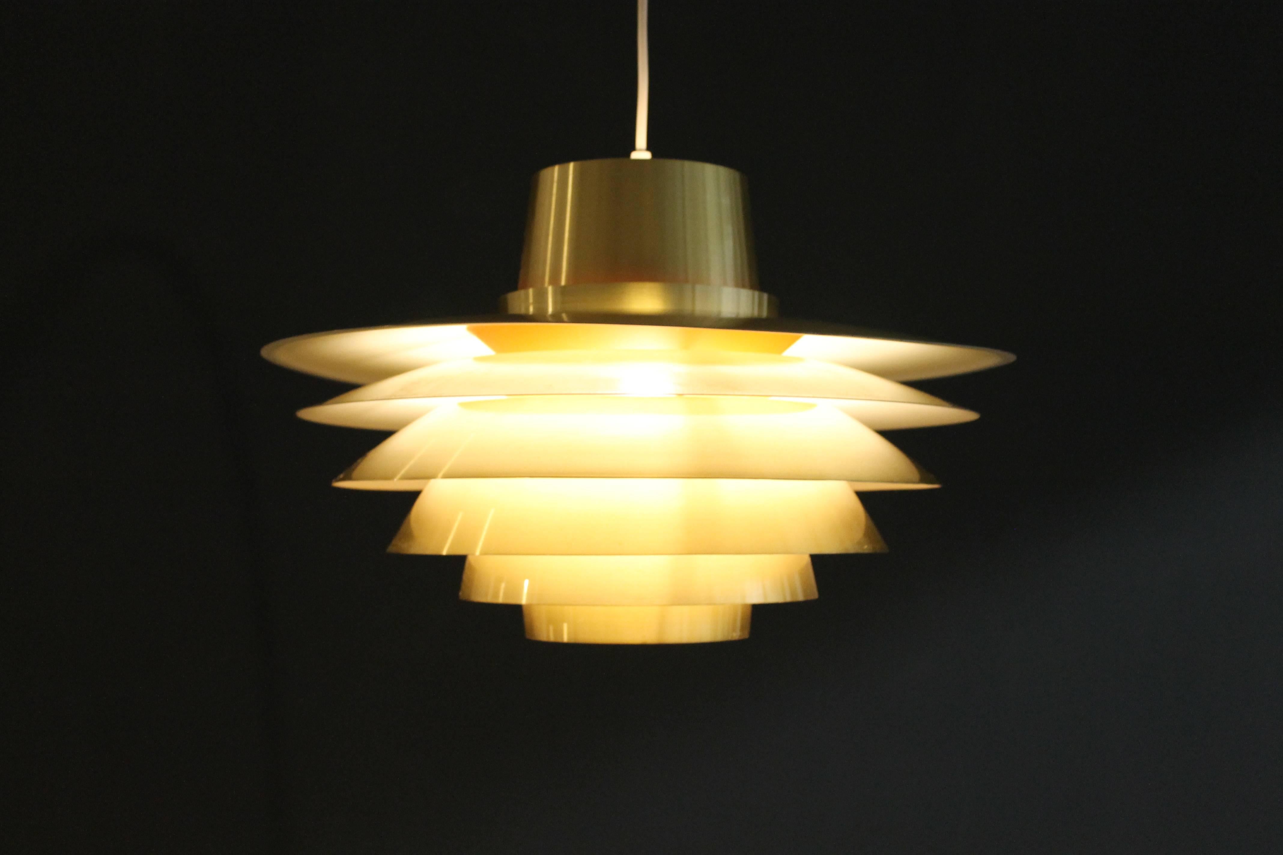 Extra large (21 inches) Verona pendent light by Svend Middelboe for Nordisk Solar, 1970s.

Danish lighting manufacturer Nordisk Solar was founded in 1919 by Jacob L. Jørgensen and Herluf Sørensen and is well-known today on the vintage markets for
