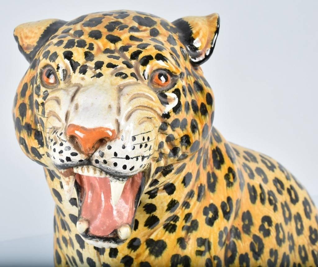 This vintage terracotta leopard statue is beautifully hand-painted with lifelike details. Pay special attention to the eyes and open mouth with teeth. At nearly 24