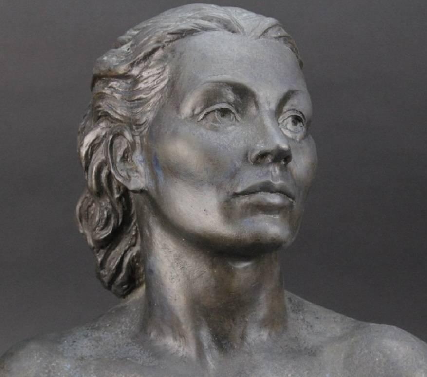 Beautiful bronze female bust by one of America's most beloved sculptors, Wheeler Williams. The piece is inscribed, "To Yosene - with admiration always - Wheeler Williams 1950." The subject's wistful glance and off the shoulder gown add to