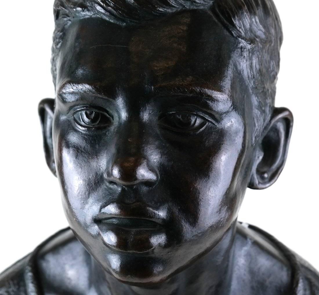 Life Sized Cast Bronze Bust of Expressive Young Boy on Oval Base In Good Condition For Sale In Houston, TX