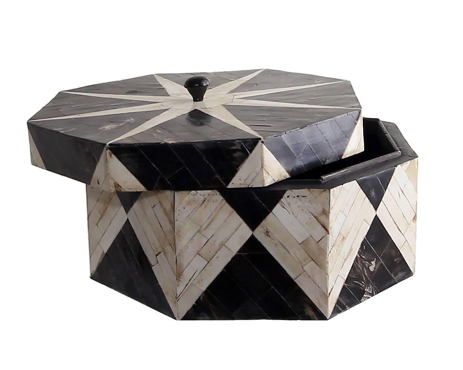 This handmade box with a beautiful star design lid presents beautifully. Handcrafted of bone and horn with great care and craftsmanship. Presents beautifully and with no chips or losses. Unmarked. Lined in black velvet.