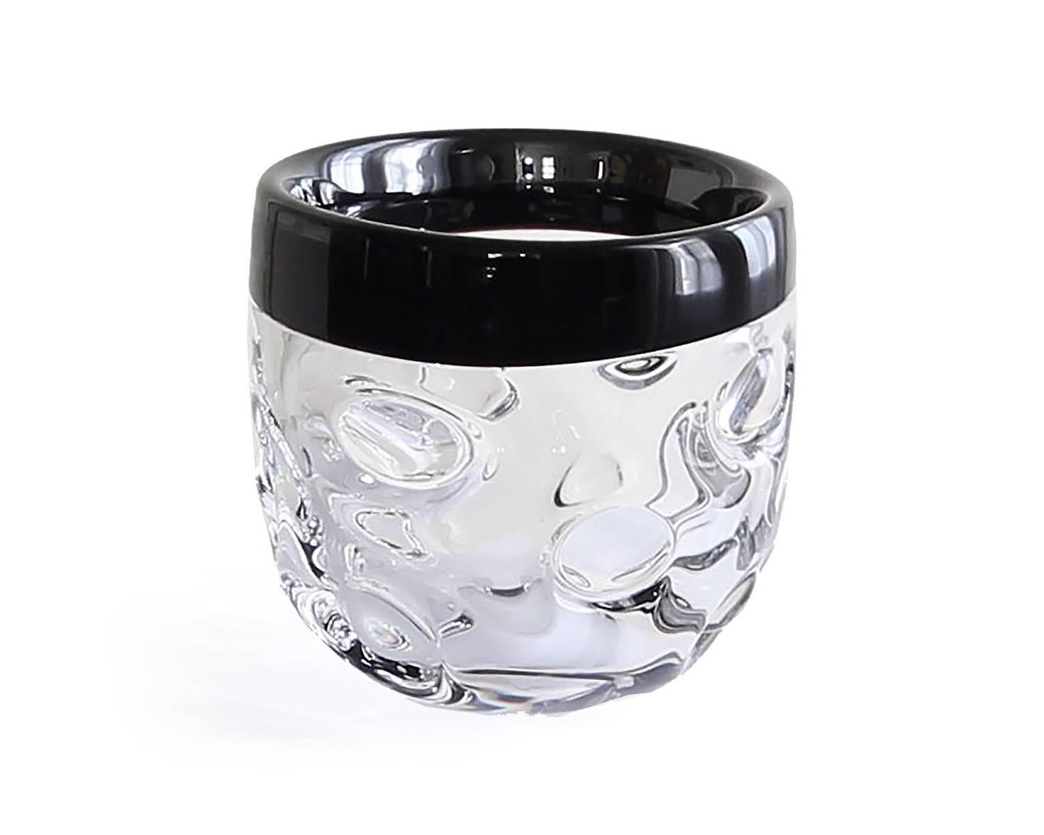 This limited edition, handcrafted crystal bowl was produced by Studio Glashyttan i Åhus AB in Sweden in 2001. The design, weight and finish of the piece all support a modern sensibility for the piece and it is in excellent condition. Edition 10 of