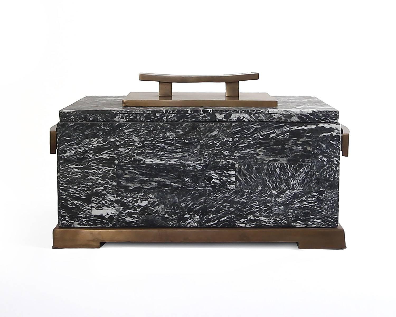 This gorgeous box by Maitland-Smith is constructed of a black and white marble shell with bronze fittings. No chips or damage. Beautiful patina on the metal. This piece is as attractive as it is functional.