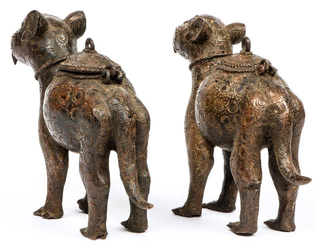 This charming, highly expressive pair of Benin Bronze Leopard Statues from Nigeria are created in the form of lidded pots. They bring a touch of tribal style to any space and are a fine example of this highly collected art form. Terrific size of for