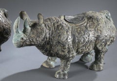 Large Pair of Bronze Chinese Rhinoceros Statues with Decorative Relief Pattern
